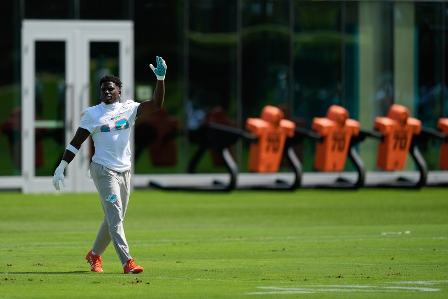 Miami Dolphins wide receiver Tyreek Hill walks on the field during a team practice session, Wednesday, Sept. 11, 2024, in Miami Gardens, Fla.(AP Photo/Rebecca Blackwell)