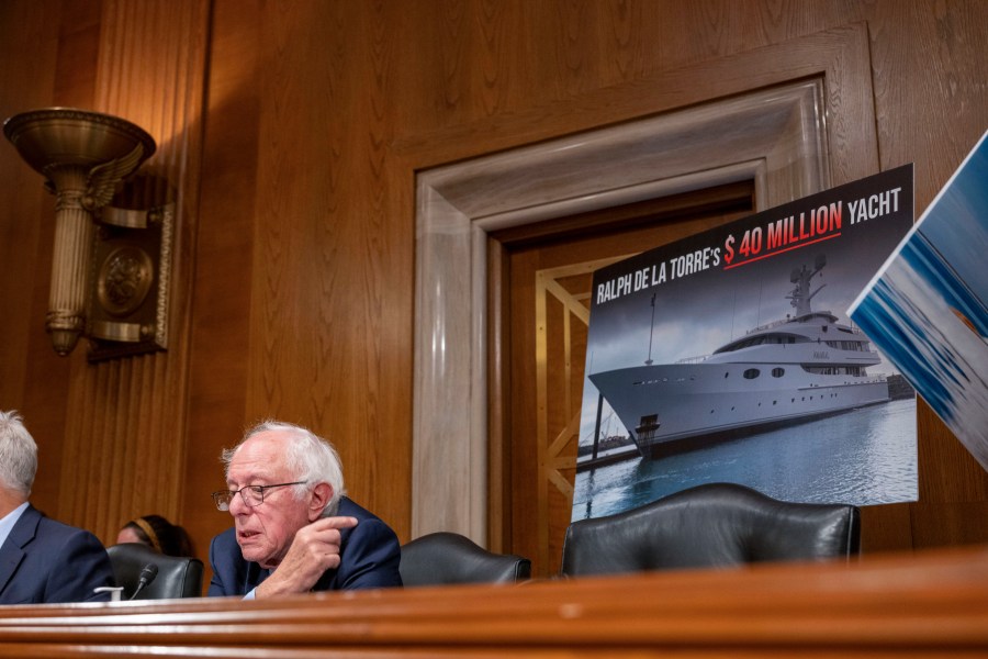 Sen. Bernie Sanders, I-Vt., points to a photo of a yacht owned by Steward Health Care System CEO Ralph de la Torre who failed to show and testify before the Senate Health, Education, Labor, and Pensions hearing to examine the bankruptcy of Steward Health Care on Thursday, Sept. 12, 2024 on Capitol Hill in Washington. (AP Photo/Kevin Wolf)