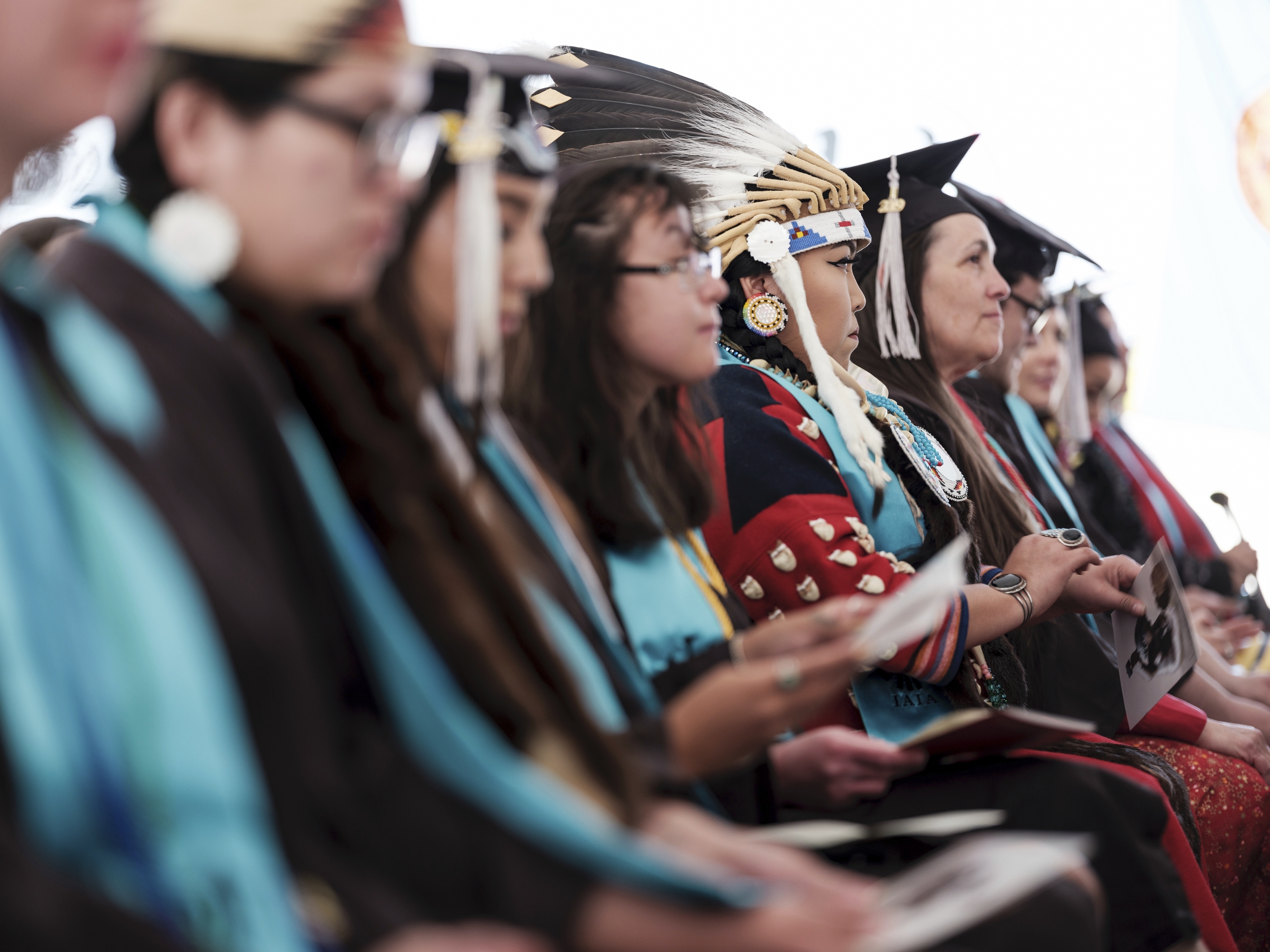 This photo provided by Jason S. Ordaz shows a commencement ceremony at the Institute of American Indian Arts in Santa Fe, N.M., in May 2019. (Jason S. Ordaz/Institute of American Indian Arts via AP)