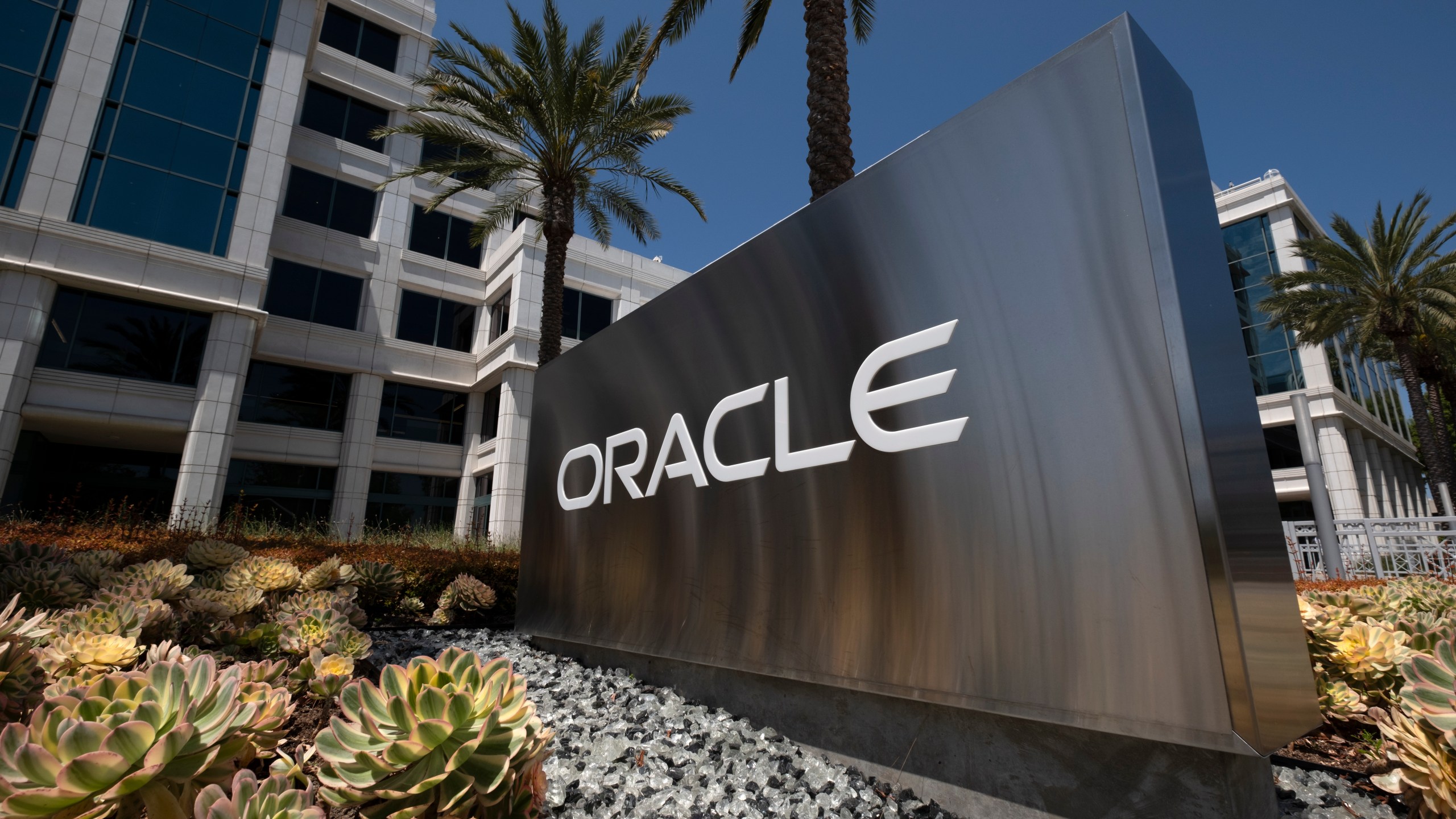 FILE - A sign for Oracle Corporation is seen outside their offices in Santa Monica, Calif. on June 21, 2023. (AP Photo/Richard Vogel, File)