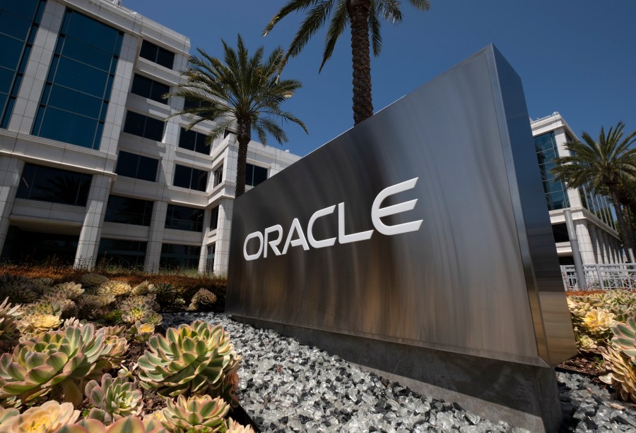 FILE - A sign for Oracle Corporation is seen outside their offices in Santa Monica, Calif. on June 21, 2023. (AP Photo/Richard Vogel, File)