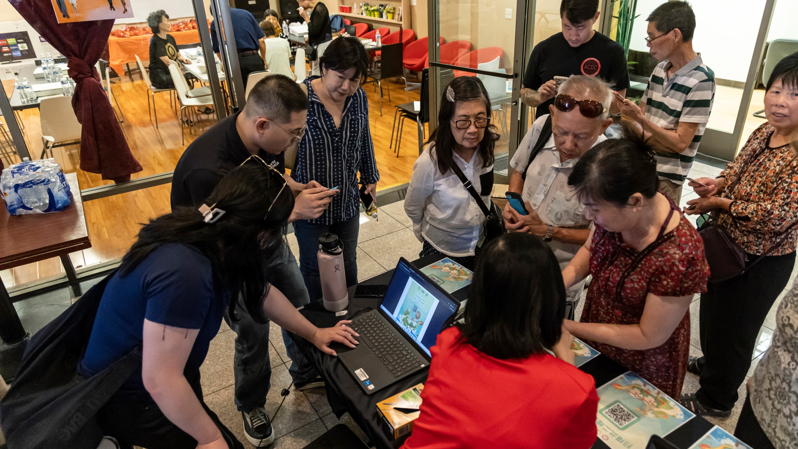 Members of the Las Vegas Asian community receive information on how to vote in Chinese during the annual Dragon Boat Festival in Las Vegas, Wednesday, June 5, 2024. Advocates are working to help non-English speakers access voting materials in their primary language. (Christopher Lomahquahu/News21 via AP)