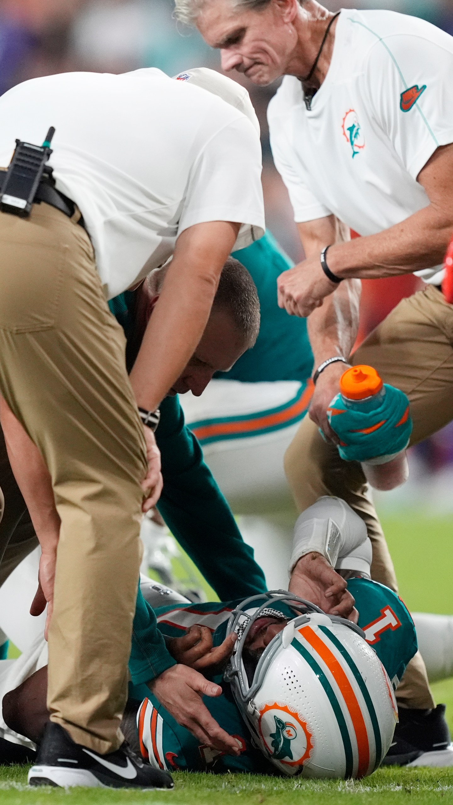 Miami Dolphins quarterback Tua Tagovailoa (1) lies on the field after suffering a concussion during the second half of an NFL football game against the Buffalo Bills, Thursday, Sept. 12, 2024, in Miami Gardens, Fla (AP Photo/Rebecca Blackwell)