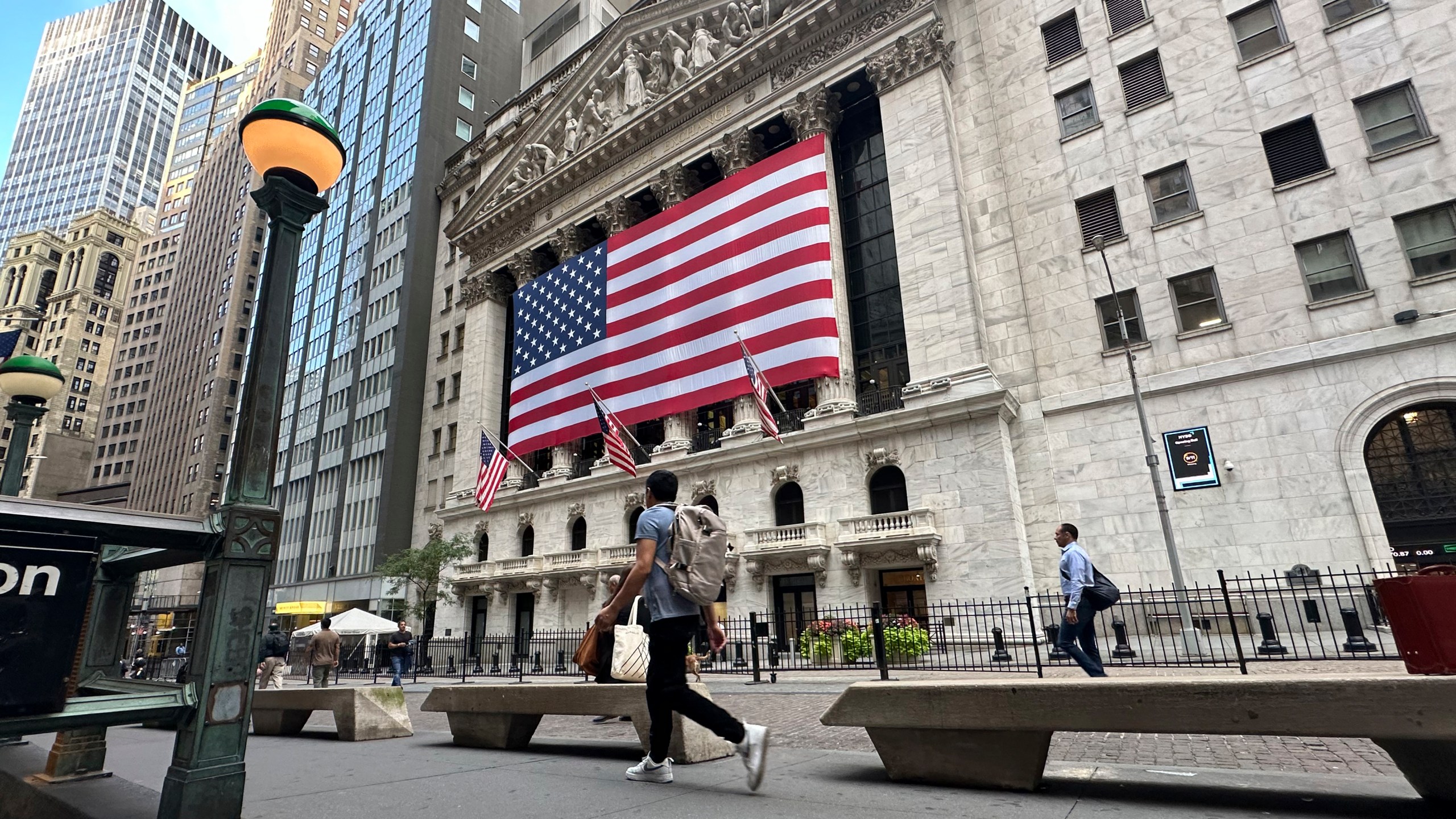 FILE - American flags hang on the front of the New York Stock Exchange on Sept. 11, 2024, in New York. (AP Photo/Peter Morgan, File)