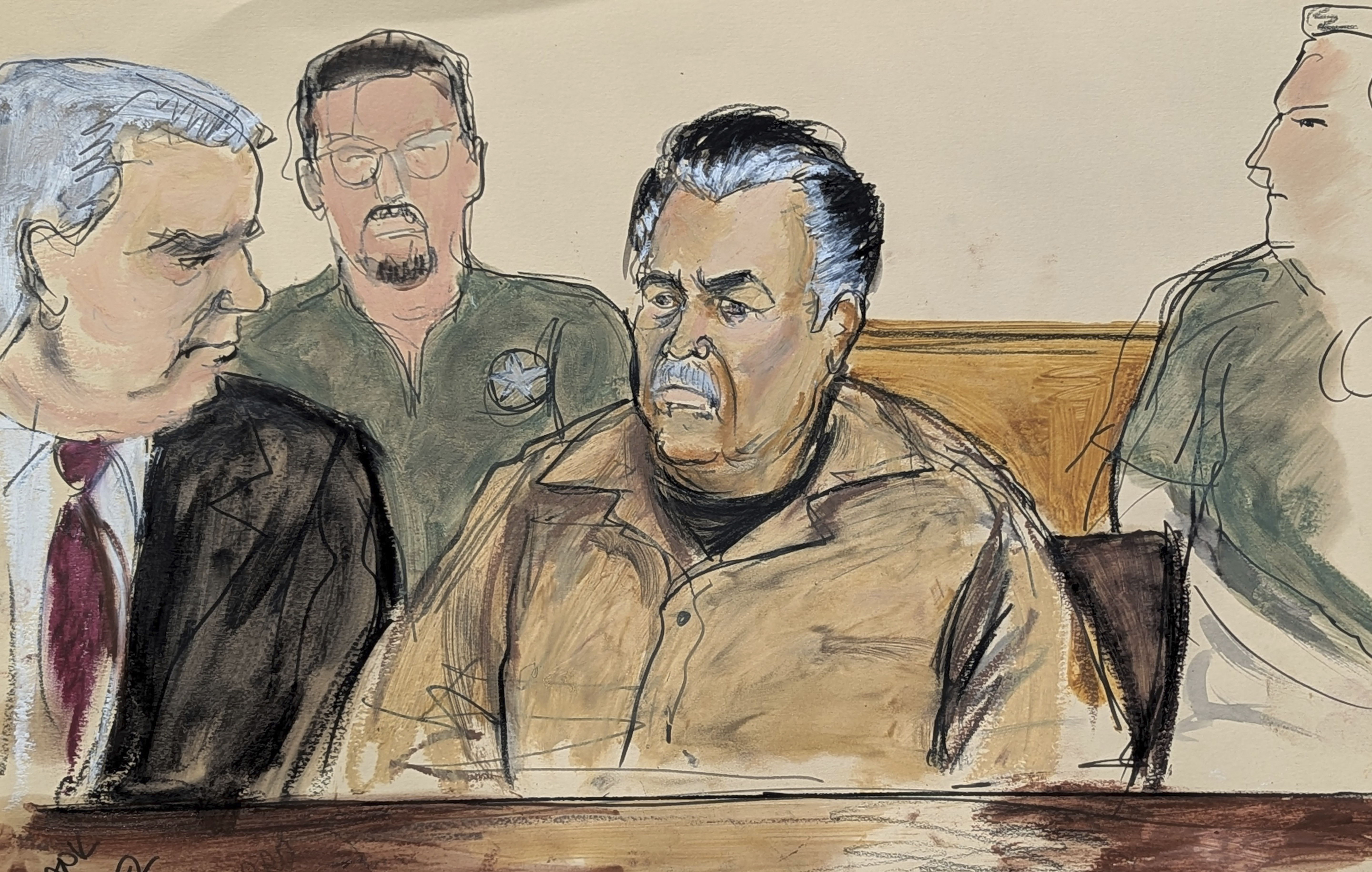 In this courtroom sketch, Ismael Zambada Garcia, El Mayo, center, is seated beside his defense attorney Frank Perez, left, in Federal court, in the Brooklyn borough of New York, Friday, Sept. 13, 2024. (Elizabeth Williams via AP)