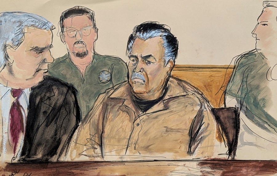 In this courtroom sketch, Ismael Zambada Garcia, El Mayo, center, is seated beside his defense attorney Frank Perez, left, in Federal court, in the Brooklyn borough of New York, Friday, Sept. 13, 2024. (Elizabeth Williams via AP)