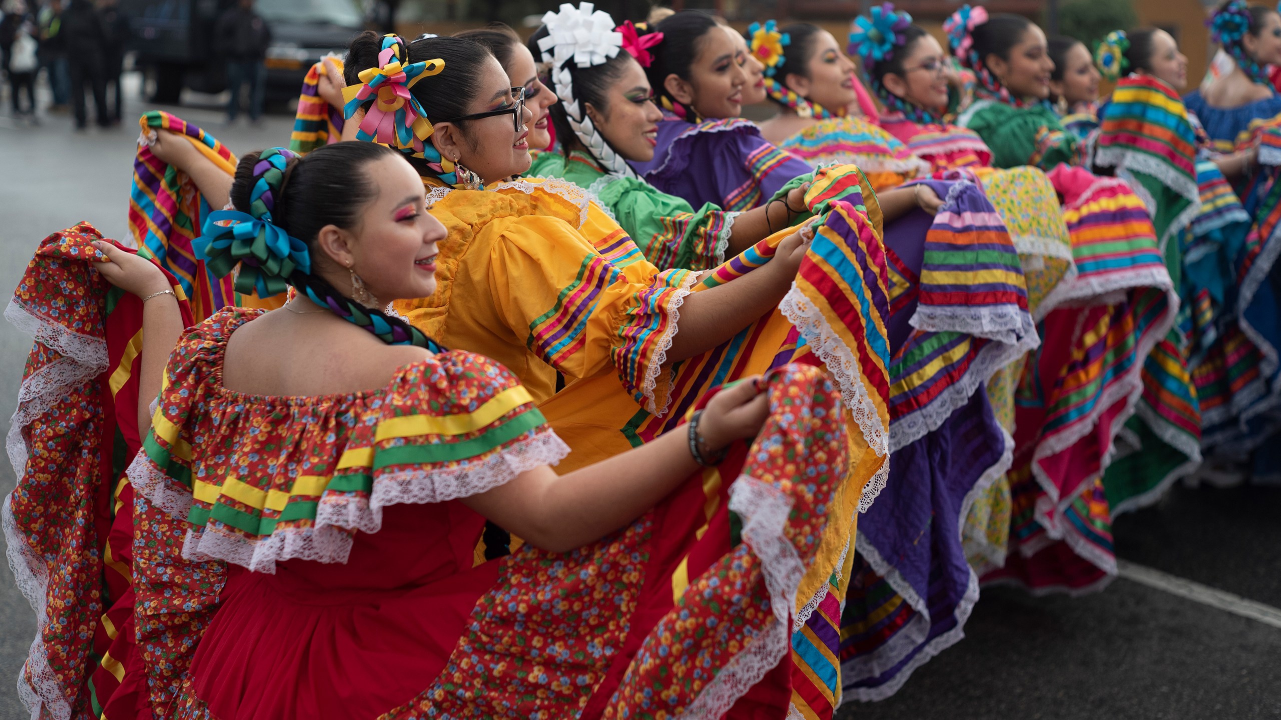 FILE - Members of the Cathedral City High School Ballet Folklorico pose for photo prior to joining in the Kingdom Day Parade in Los Angeles, Jan. 16, 2023. (AP Photo/Richard Vogel, File)