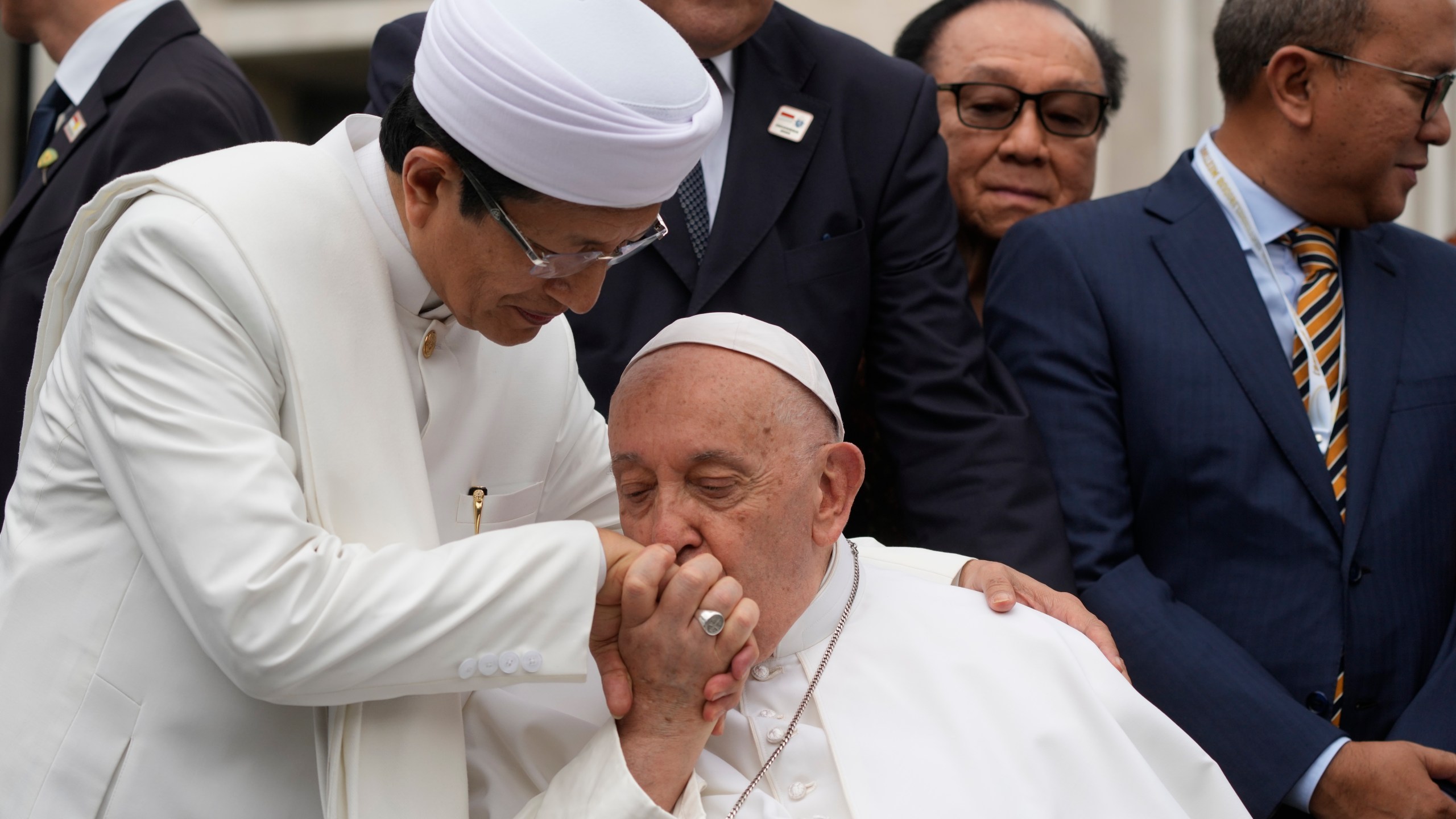 Pope Francis, bids farewell to The Grand Imam Nasaruddin Umar, left, as he leaves after signing the "Joint Declaration of Istiqlal 2024" at the Istiqlal Mosque in Jakarta, Thursday, Sept. 5, 2024. Even in the most delicate moment of his Asian trip in Jakarta, at Southeast Asia's biggest mosque, Francis threw protocol aside and kissed the hand of the grand imam and brought it to his cheek in gratitude. (AP Photo/Gregorio Borgia)