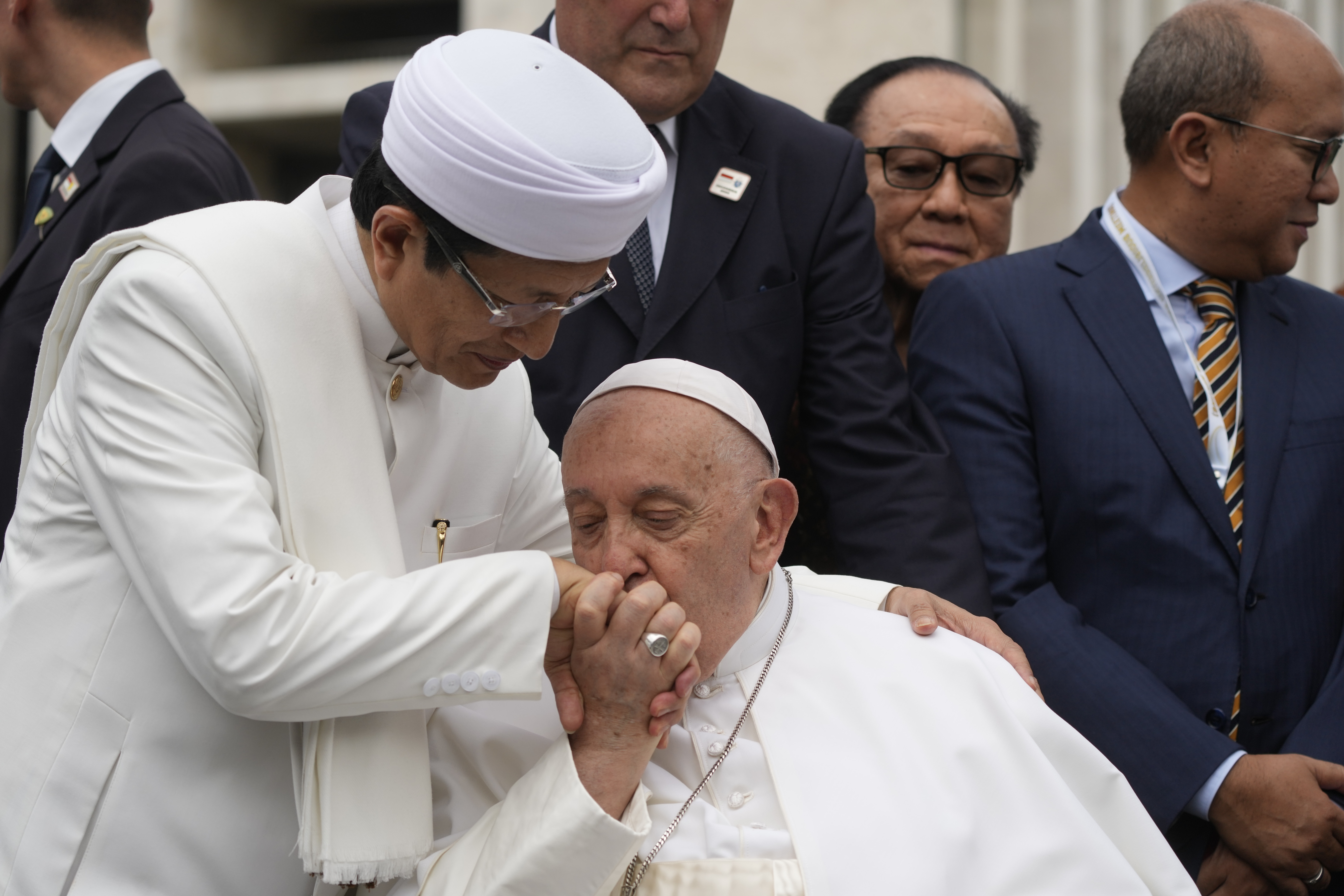 Pope Francis, bids farewell to The Grand Imam Nasaruddin Umar, left, as he leaves after signing the "Joint Declaration of Istiqlal 2024" at the Istiqlal Mosque in Jakarta, Thursday, Sept. 5, 2024. Even in the most delicate moment of his Asian trip in Jakarta, at Southeast Asia's biggest mosque, Francis threw protocol aside and kissed the hand of the grand imam and brought it to his cheek in gratitude. (AP Photo/Gregorio Borgia)