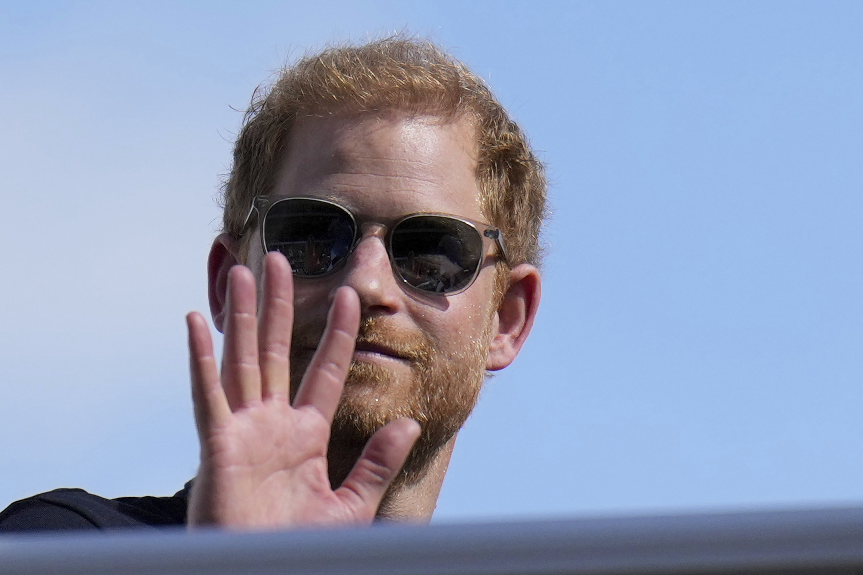 FILE - Britain's Prince Harry, the Duke of Sussex, waves during the Formula One U.S. Grand Prix auto race at Circuit of the Americas, on Oct. 22, 2023, in Austin, Texas. (AP Photo/Nick Didlick, File)