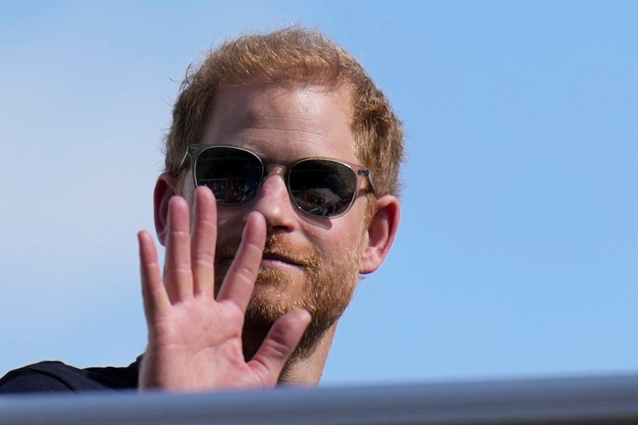 FILE - Britain's Prince Harry, the Duke of Sussex, waves during the Formula One U.S. Grand Prix auto race at Circuit of the Americas, on Oct. 22, 2023, in Austin, Texas. (AP Photo/Nick Didlick, File)