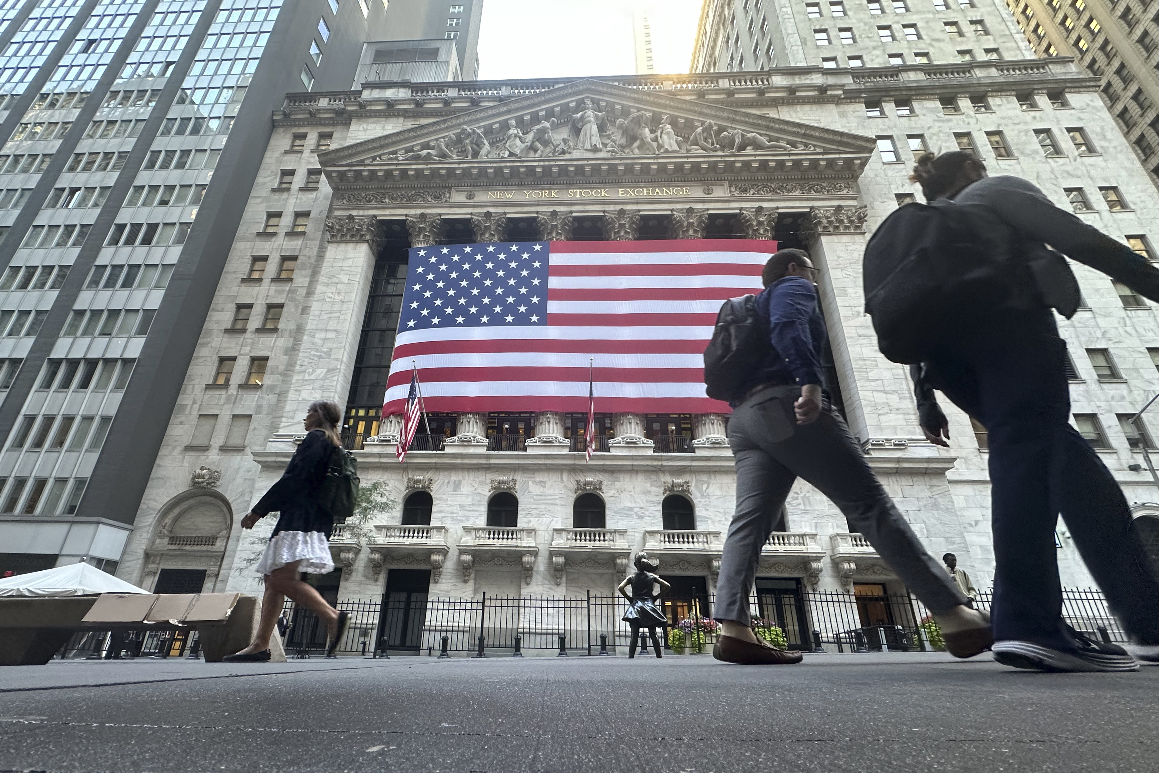 FILE - The American flag hangs from the front of the New York Stock Exchange on Sept. 10, 2024, in New York. (AP Photo/Peter Morgan, File)