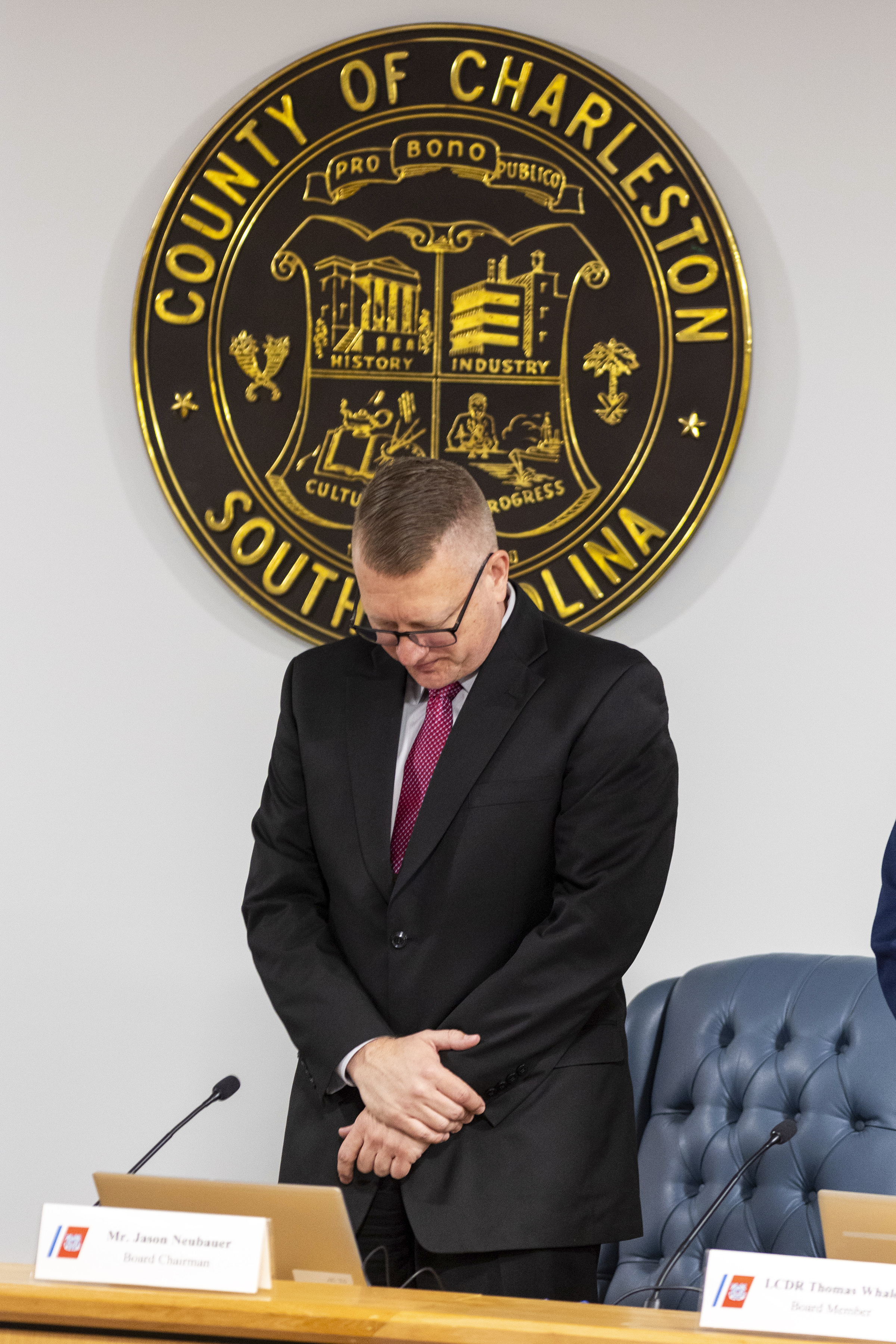 Jason Neubauer, board chairman, of the investigative board for the Titan marine board formal hearing pauses for a moment of silence inside the Charleston County Council Chambers Monday, Sept. 16, 2024, in North Charleston, S.C. (AP Photo/Mic Smith)