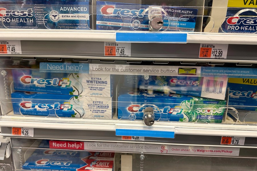 FILE - Tubes of toothpaste are displayed behind a locked, plastic barrier to prevent shoplifters from stealing the products at a store in the Manhattan borough of New York on January 31, 2024. (AP Photo/Ted Shaffrey)