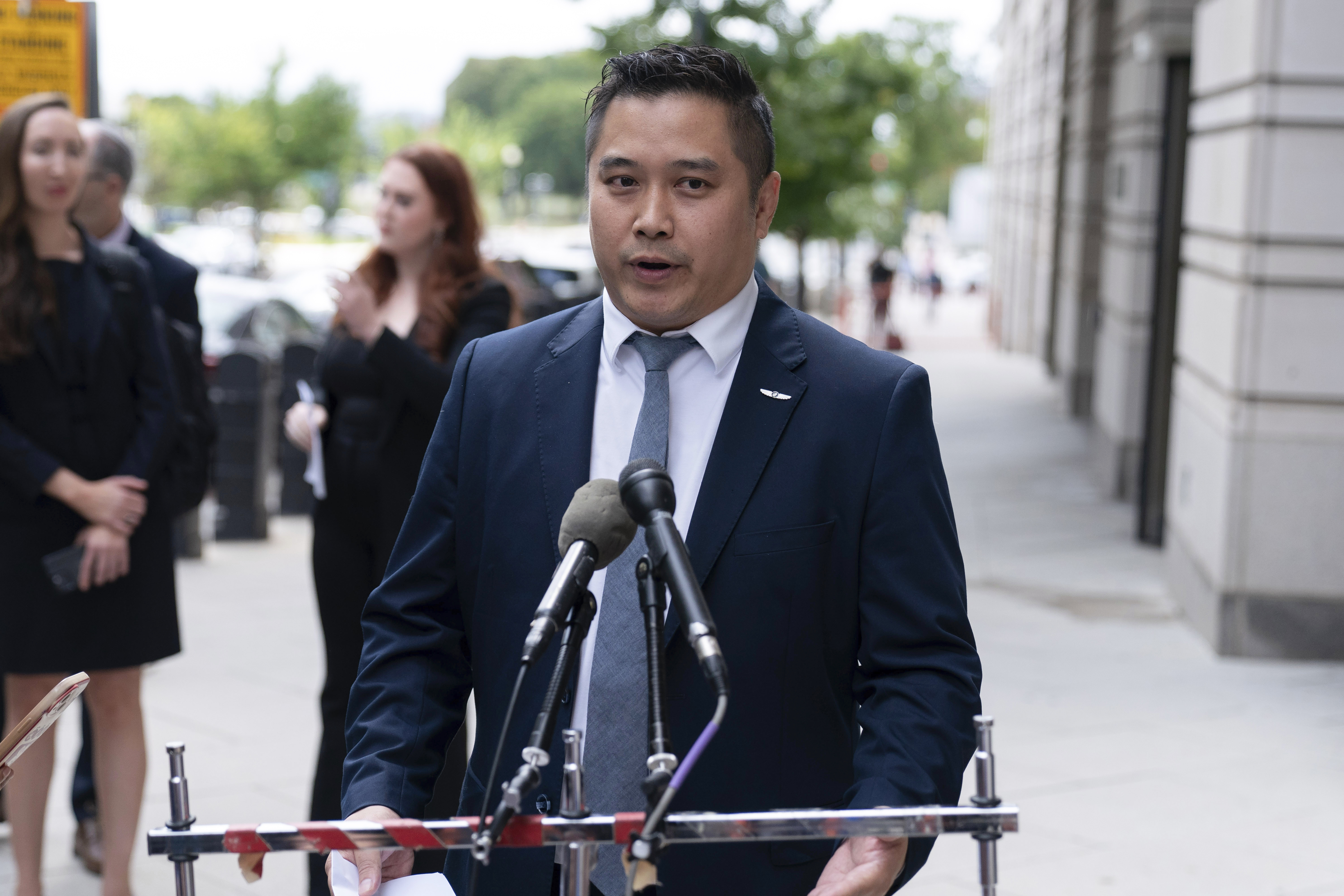 TikTok content creator Paul Tran talks to the press as he leaves the federal courthouse in Washington, Monday, Sept. 16, 2024, after a hearing on TikTok's lawsuit against the federal government. (AP Photo/Jose Luis Magana)