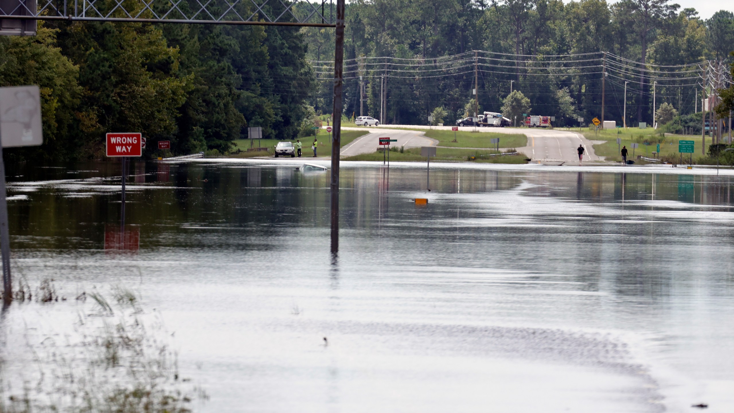 Flooding from heavy rains closed U.S Highway 17 near Winnabow, south of Wilmington, N.C., on Tuesday, Sept.17, 2024. (AP Photo/Chris Seward)