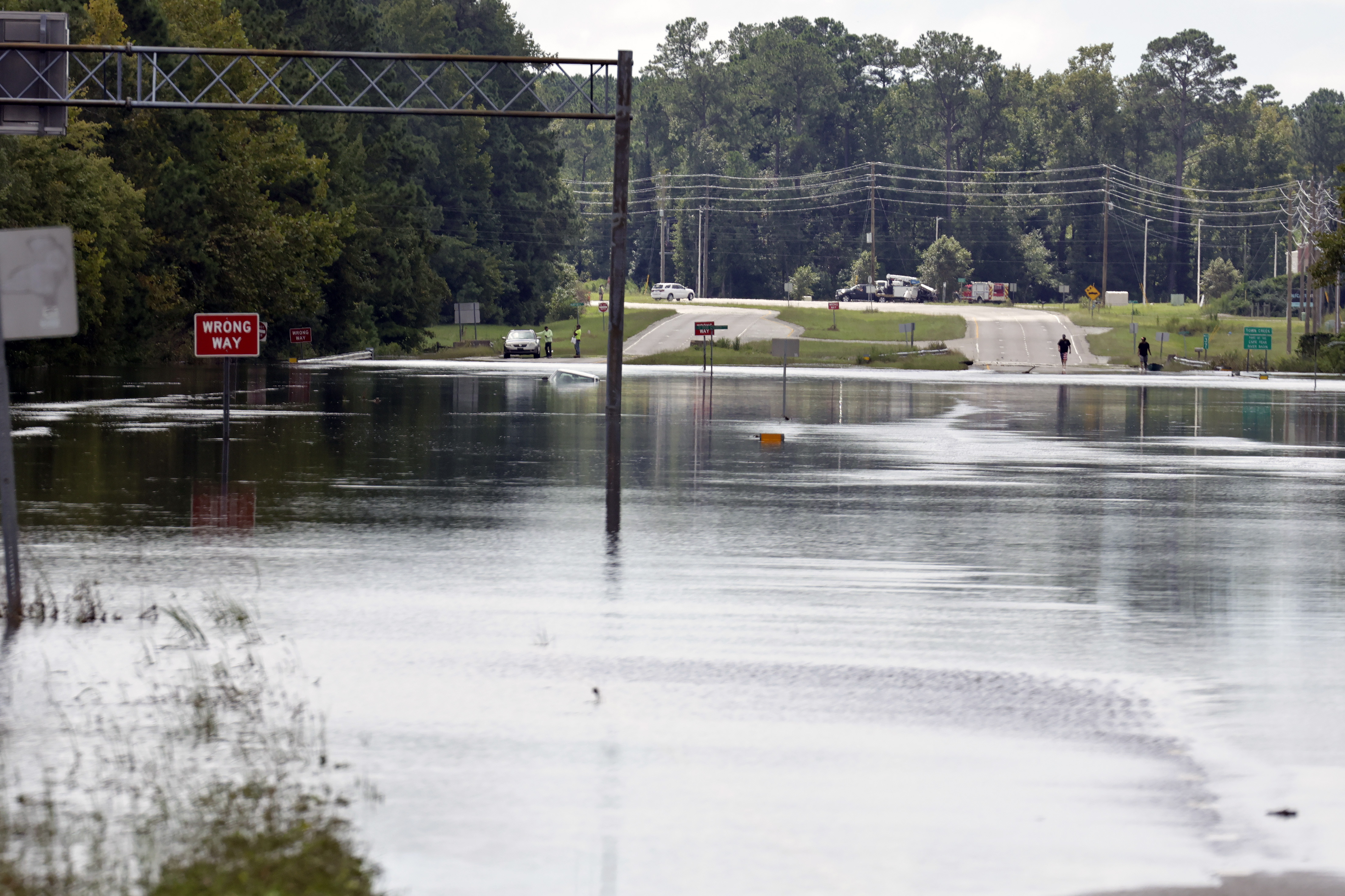 Flooding from heavy rains closed U.S Highway 17 near Winnabow, south of Wilmington, N.C., on Tuesday, Sept.17, 2024. (AP Photo/Chris Seward)