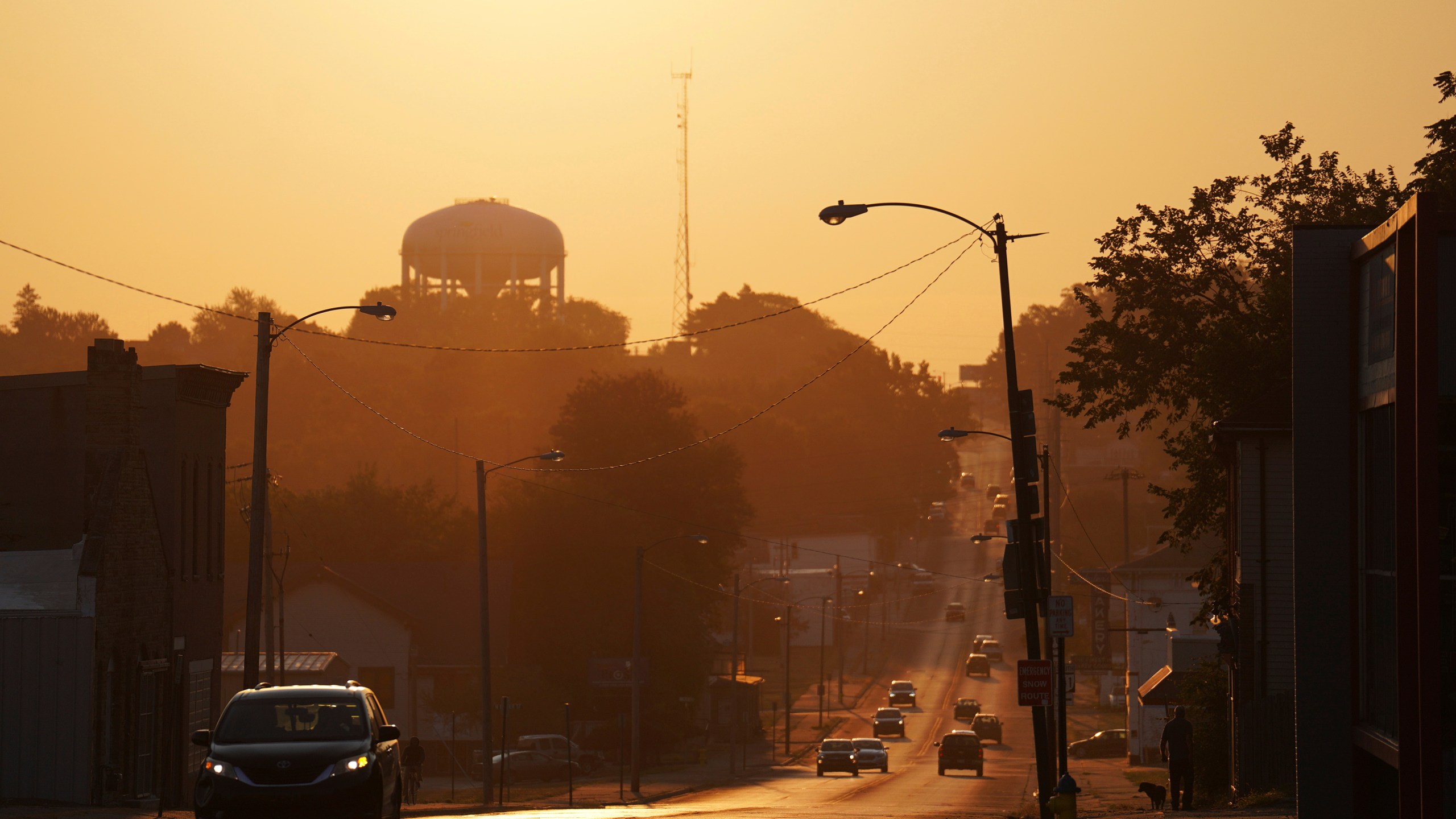 The sun rises over the city of Springfield, Ohio, Monday, Sept. 16, 2024. (AP Photo/Jessie Wardarski)