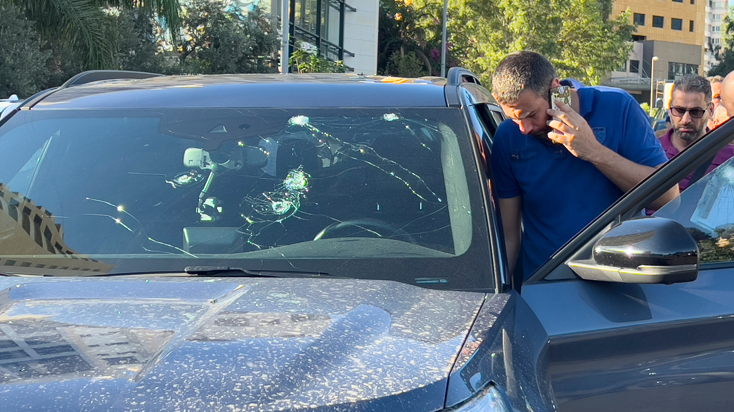 Police officers inspect a car inside of which a hand-held pager exploded, Beirut, Lebanon, Tuesday, Sept. 17, 2024. (AP Photo/Hussein Malla)