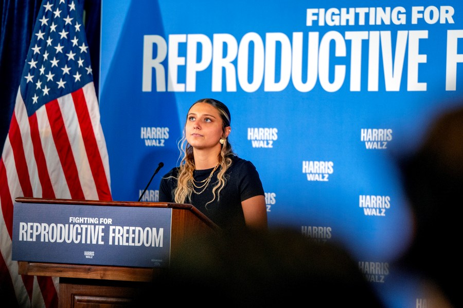 Hadley Duvall, a sexual assault survivor and reproductive rights advocate who spoke at the Democratic National Convention, joins a rally for Vice President Harris at the Independence Visitor Center in Philadelphia, Sunday, Sept. 15, 2024. Gov. Josh Shapiro headlined the reproductive rights rally before the campaign's national "Fighting for Reproductive Freedom" bus departed on a tour across Pennsylvania. (Tom Gralish/The Philadelphia Inquirer via AP)