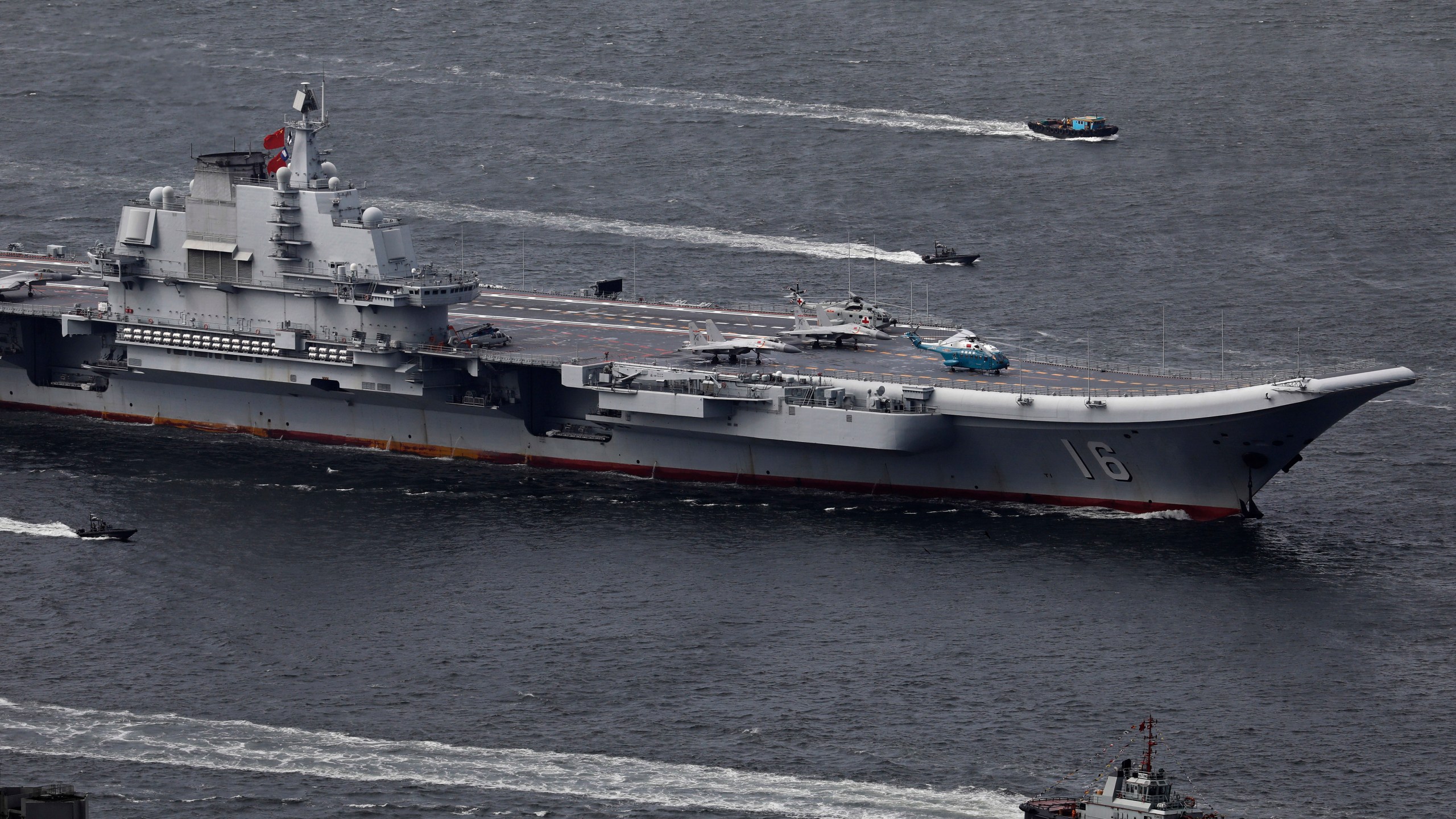 FILE -The Liaoning, China's first aircraft carrier, sails into Hong Kong for a port call to celebrate the 20th anniversary of the People's Liberation Army (PLA) garrison's presence in the semi-autonomous Chinese city and former British colony on July 7, 2017. (AP Photo/Vincent Yu, File)