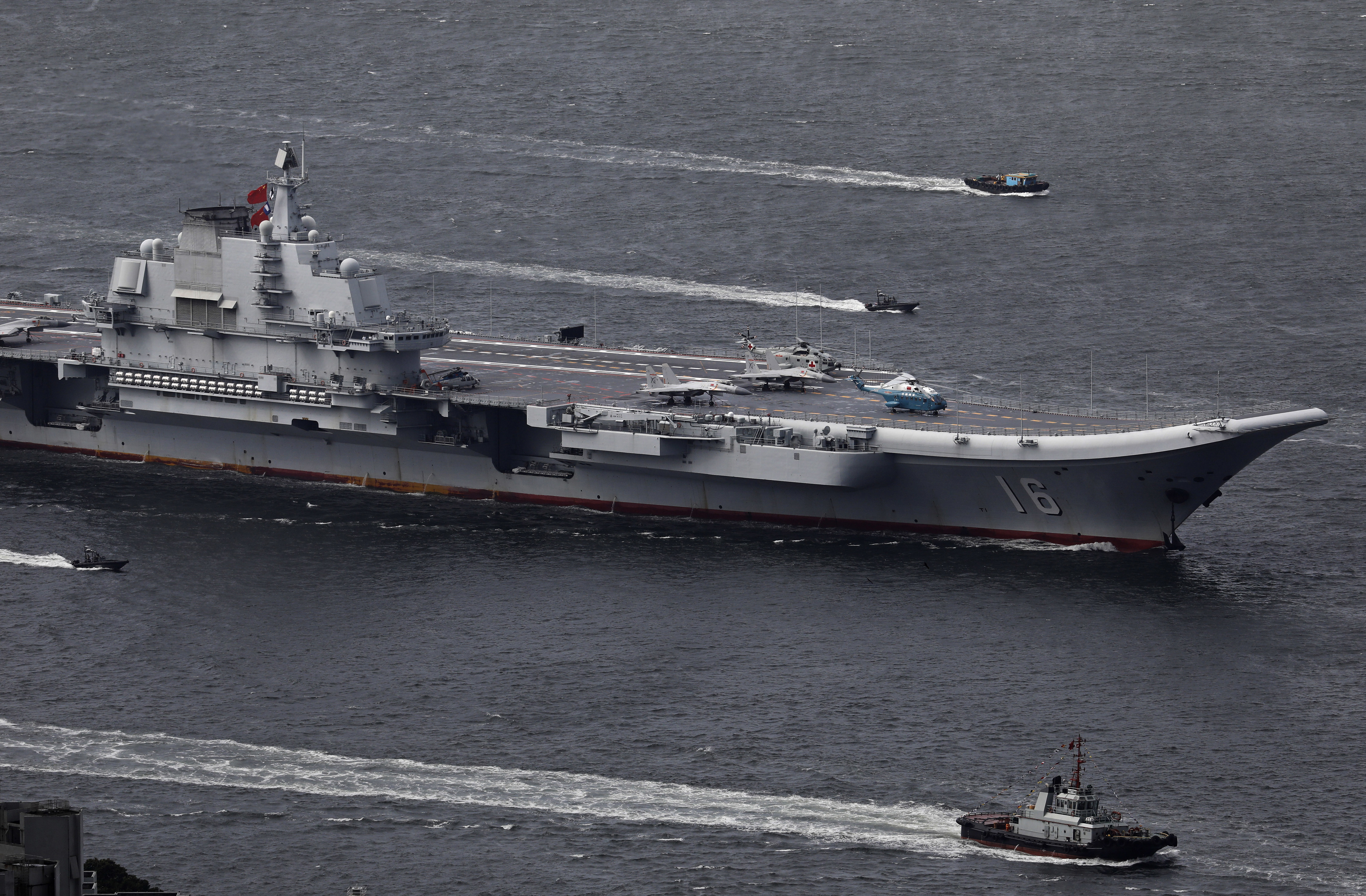 FILE -The Liaoning, China's first aircraft carrier, sails into Hong Kong for a port call to celebrate the 20th anniversary of the People's Liberation Army (PLA) garrison's presence in the semi-autonomous Chinese city and former British colony on July 7, 2017. (AP Photo/Vincent Yu, File)