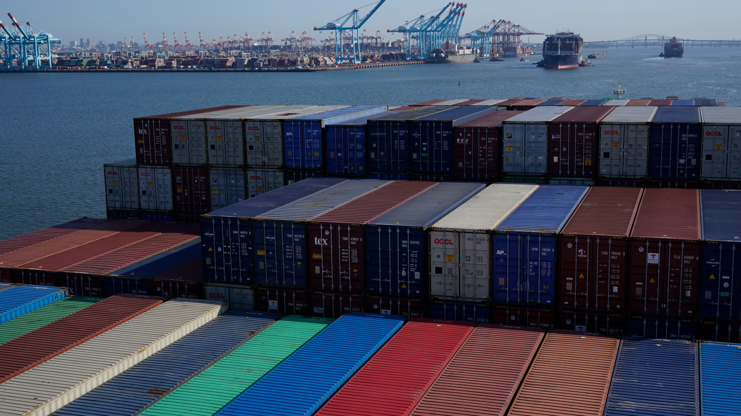 FILE - A container ship makes it way toward the Port of New York and New Jersey in Elizabeth, N.J., on June 30, 2021. (AP Photo/Seth Wenig, File)