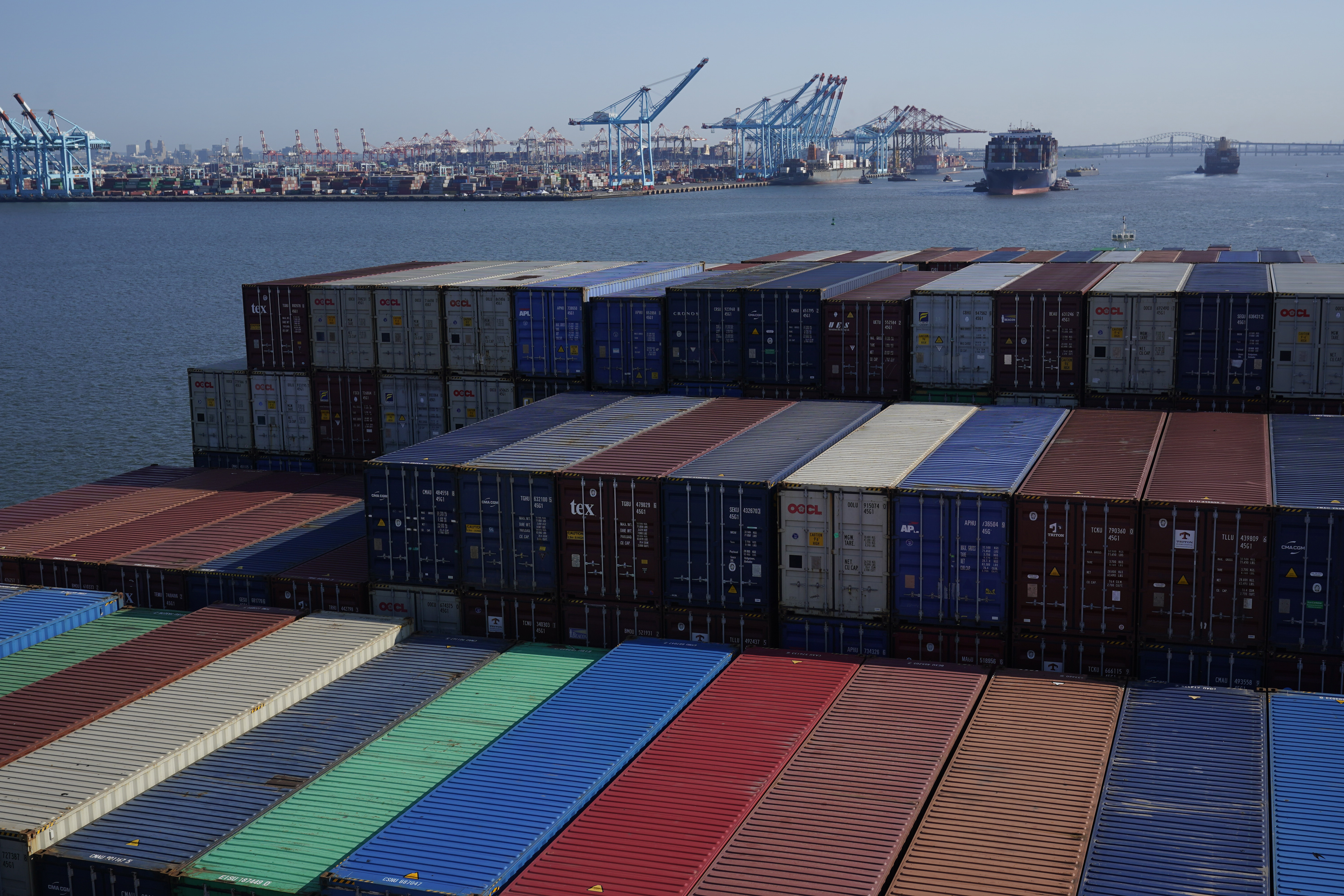 FILE - A container ship makes it way toward the Port of New York and New Jersey in Elizabeth, N.J., on June 30, 2021. (AP Photo/Seth Wenig, File)