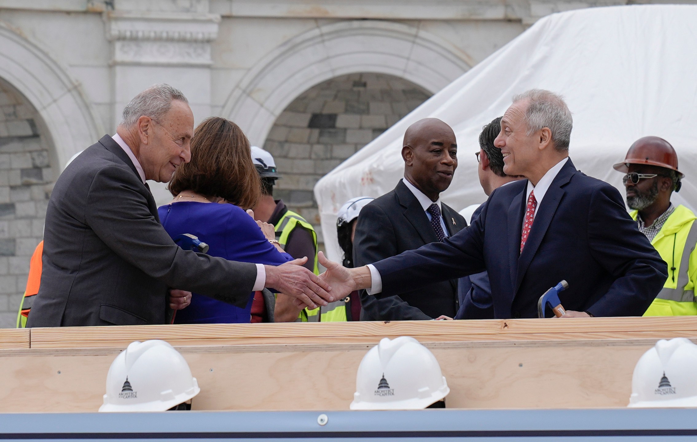 House Majority Leader Steve Scalise, R-La., right and Senate Majority Leader Chuck Schumer, D-N.Y., are seen after the First Nail Ceremony marking the beginning of construction of the 2025 Presidential Inauguration platform, on the steps of the Capitol, Wednesday, Sept. 18, 2024, in Washington. (AP Photo/Mariam Zuhaib)