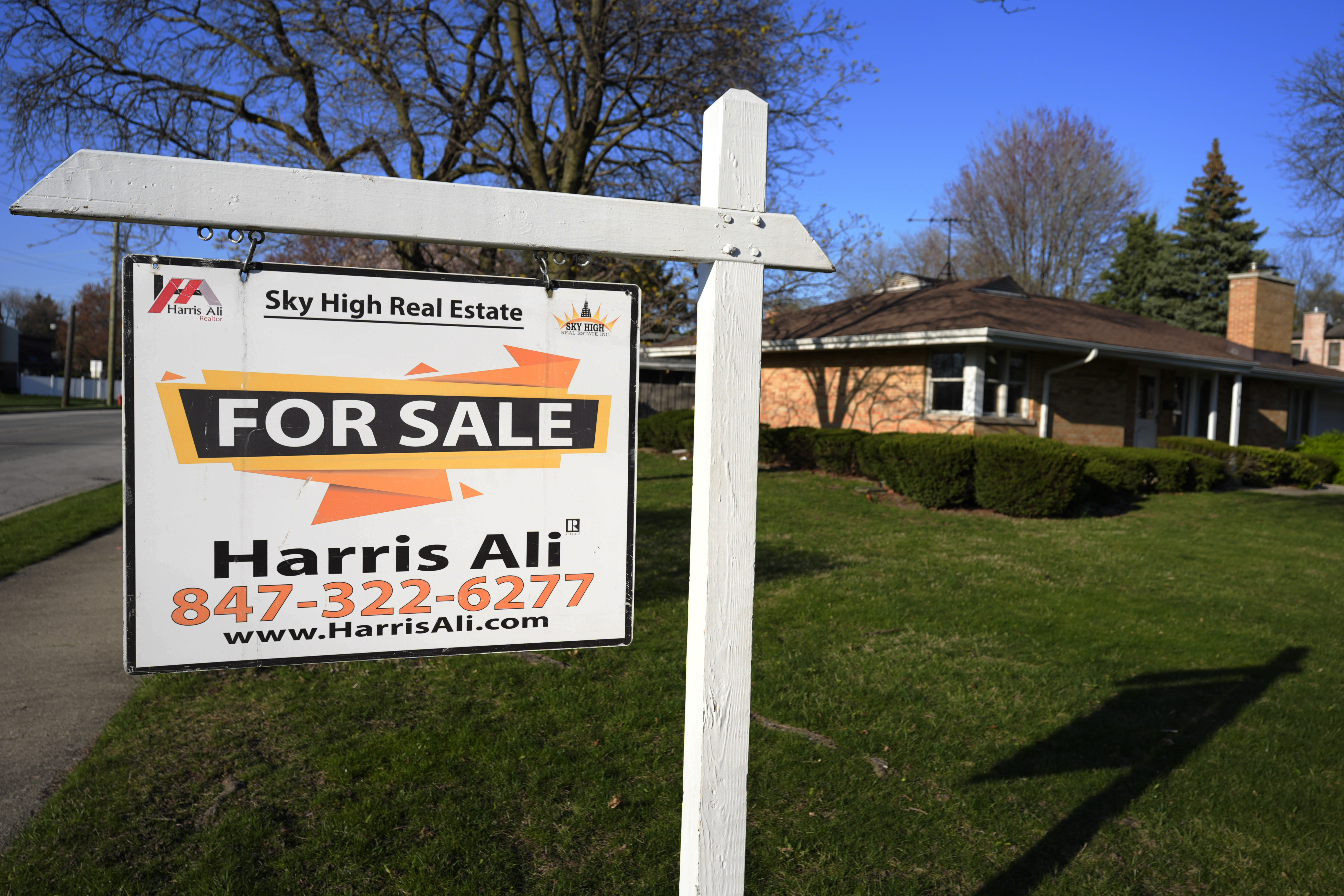 FILE - A "For Sale" sign is displayed in front of a home in Skokie, Ill., April 14, 2024. (AP Photo/Nam Y. Huh, File)