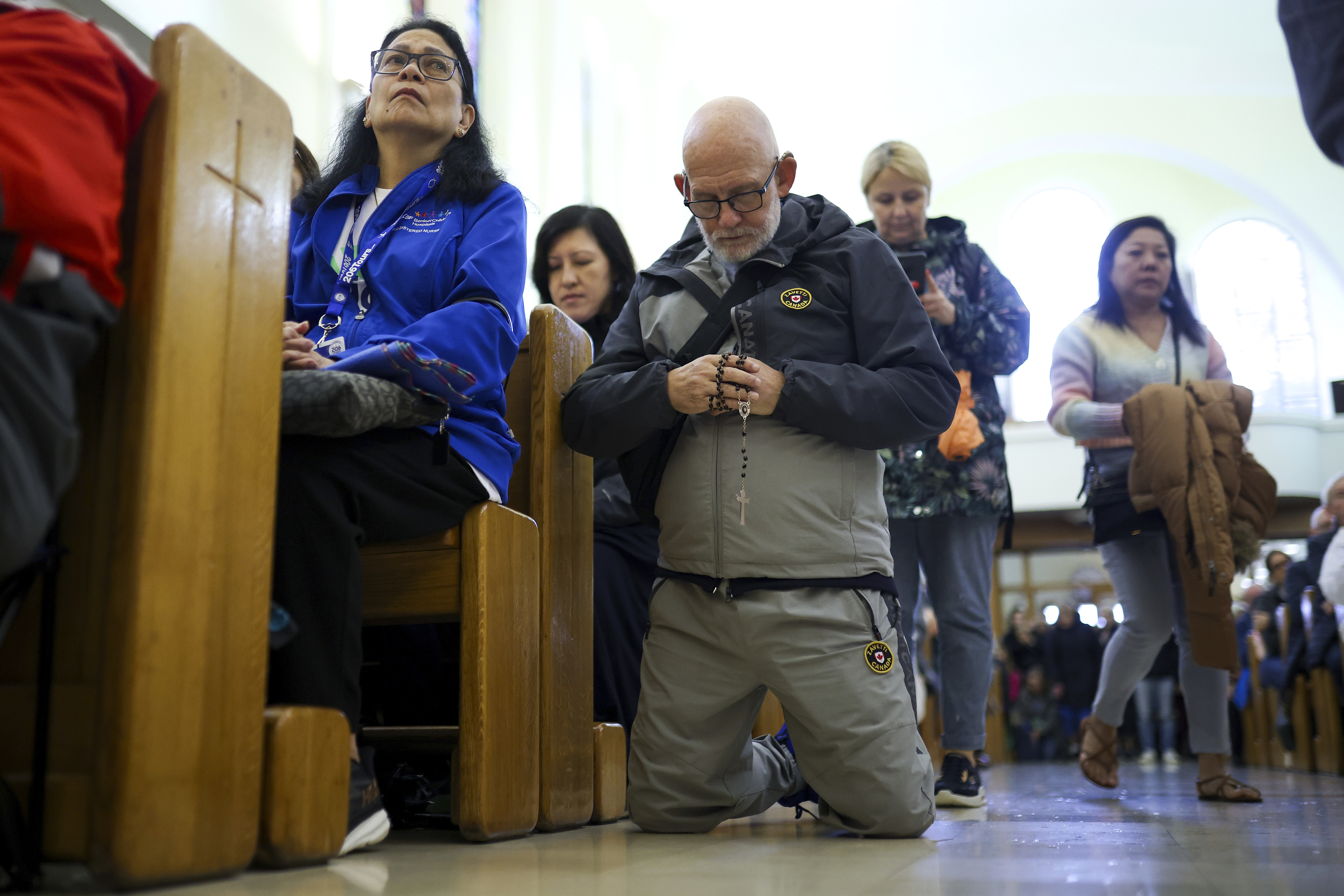 Pilgrims say their prayers inside the St. James Church in Medjugorje, Bosnia, Thursday, Sept. 19, 2024. (AP Photo/Armin Durgut)