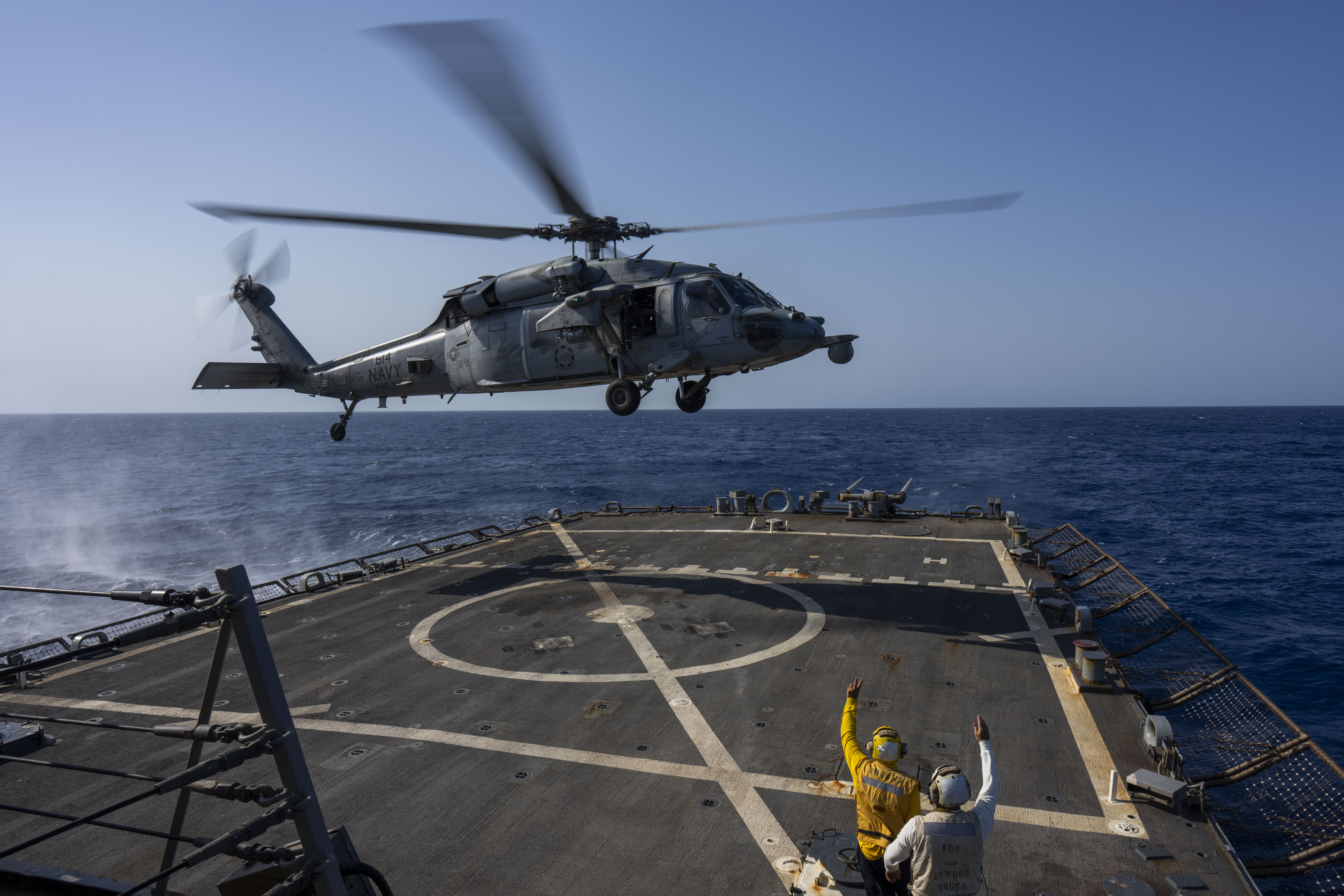 FILE - An HSC-7 helicopter lands on the Arleigh Burke-class guided missile destroyer USS Laboon in the Red Sea, June 12, 2024. (AP Photo/Bernat Armangue, File)