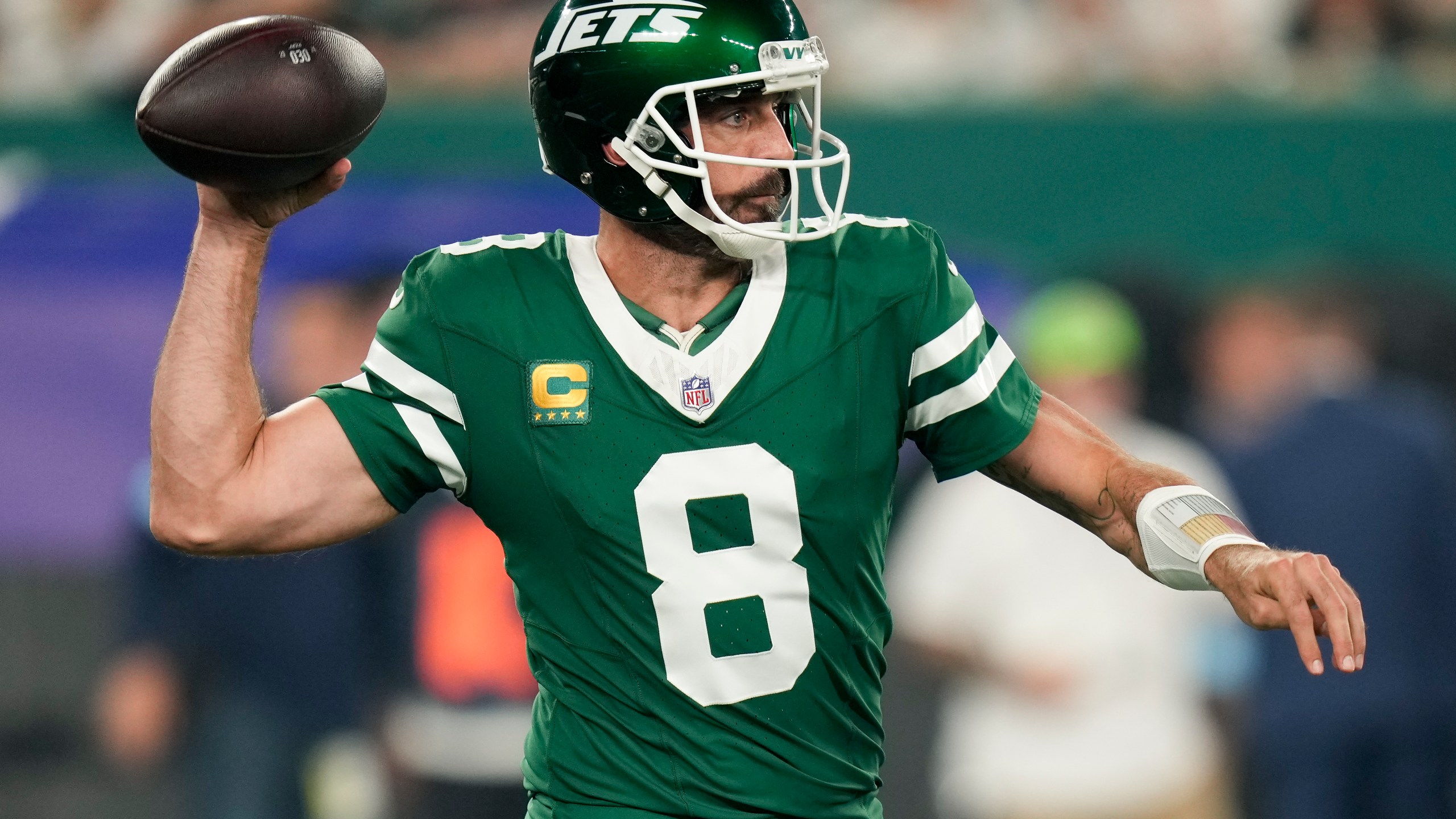 New York Jets quarterback Aaron Rodgers (8) passes against the New England Patriots during the first quarter of an NFL football game, Thursday, Sept. 19, 2024, in East Rutherford, N.J. (AP Photo/Seth Wenig)