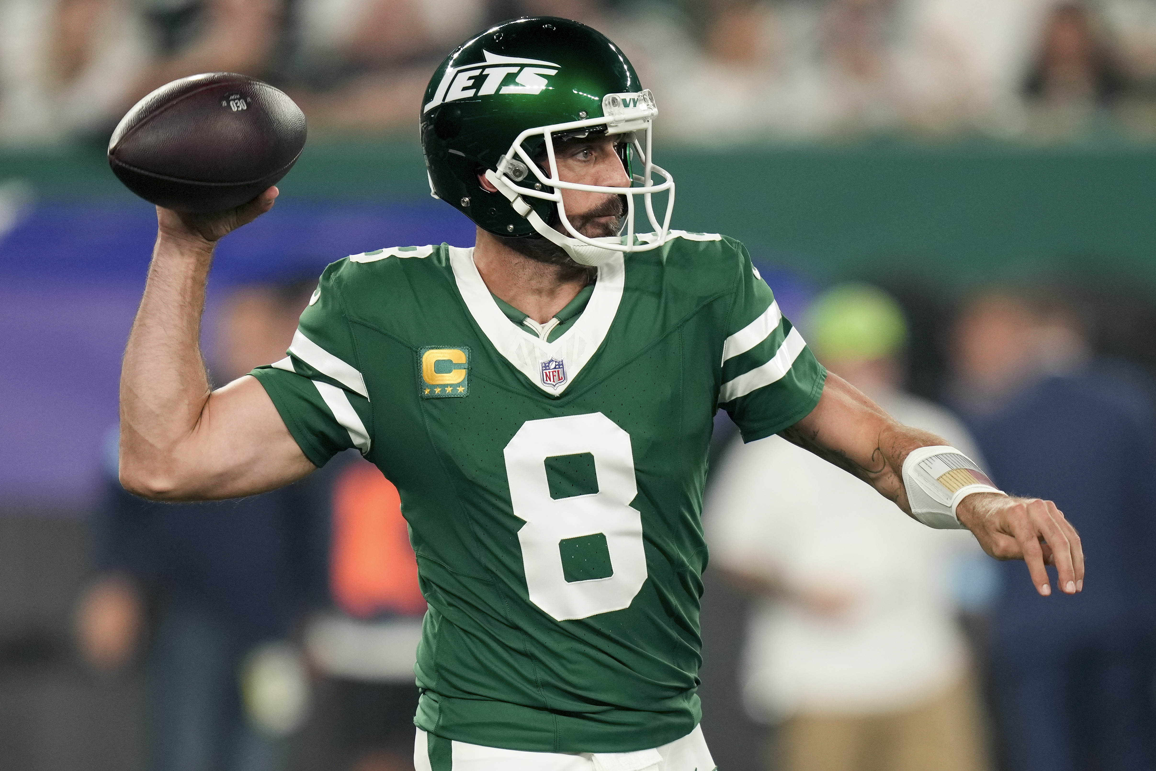 New York Jets quarterback Aaron Rodgers (8) passes against the New England Patriots during the first quarter of an NFL football game, Thursday, Sept. 19, 2024, in East Rutherford, N.J. (AP Photo/Seth Wenig)