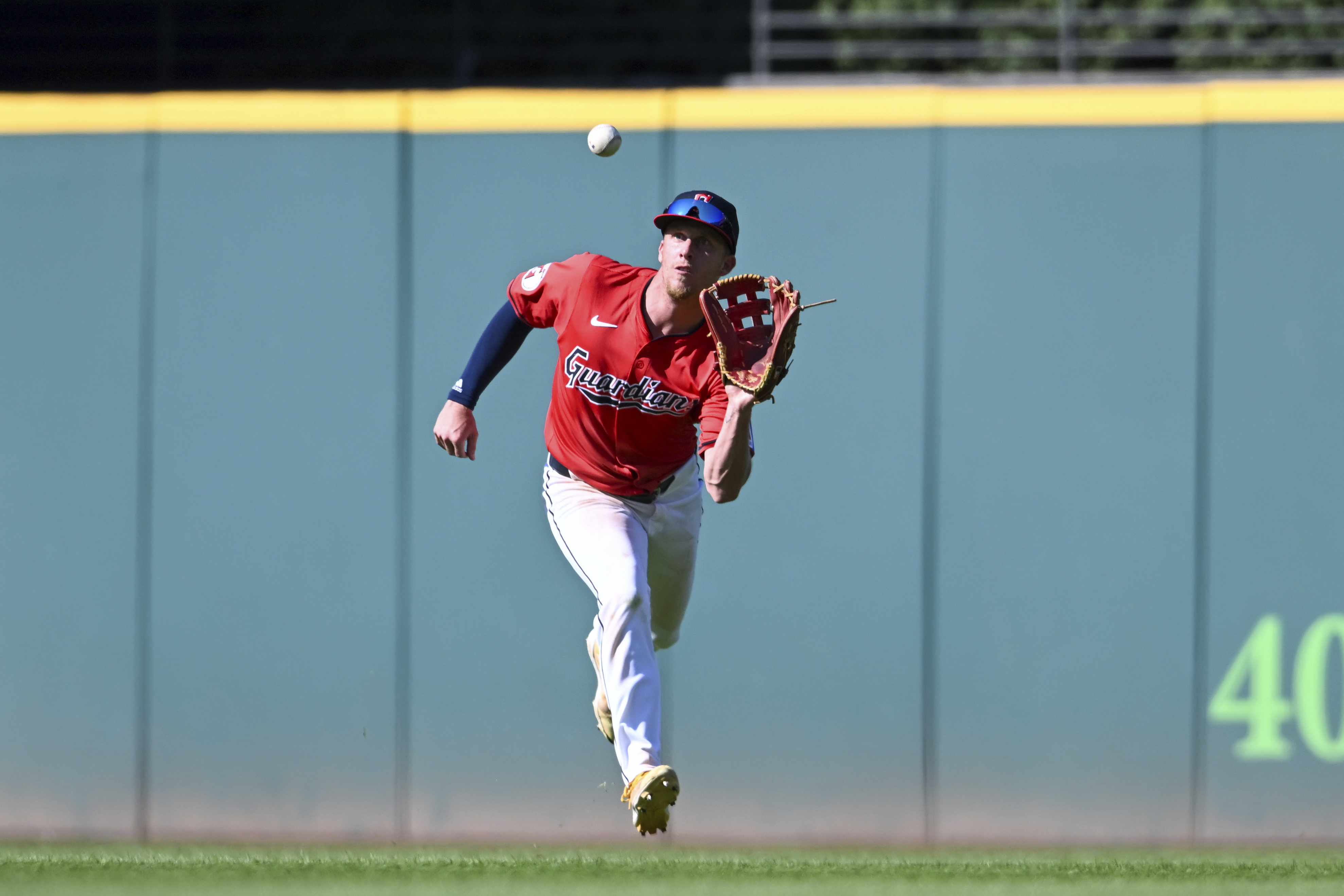 Cleveland Guardians' Myles Straw catches a fly ball during the ninth inning of a baseball game against the Minnesota Twins, Thursday, Sept. 19, 2024, in Cleveland. (AP Photo/Nick Cammett)