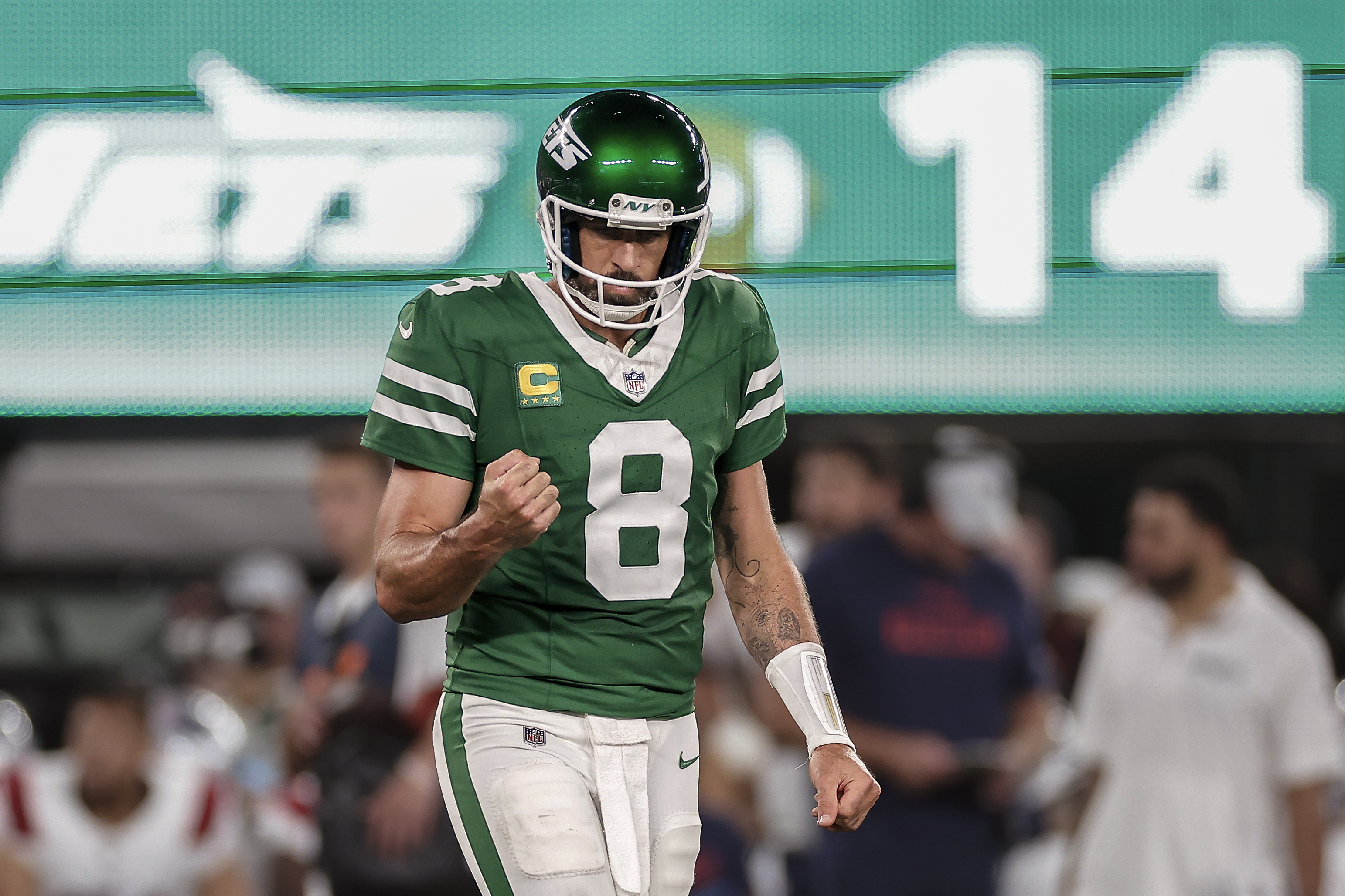 New York Jets quarterback Aaron Rodgers (8) reacts during the third quarter of an NFL football game against the New England Patriots, Thursday, Sept. 19, 2024, in East Rutherford, N.J. (AP Photo/Adam Hunger)