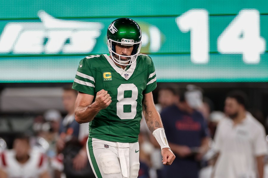 New York Jets quarterback Aaron Rodgers (8) reacts during the third quarter of an NFL football game against the New England Patriots, Thursday, Sept. 19, 2024, in East Rutherford, N.J. (AP Photo/Adam Hunger)