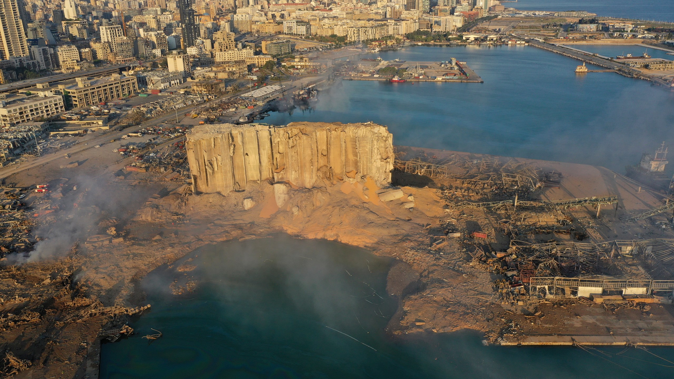 FILE - A drone picture shows the scene of an explosion that hit the seaport of Beirut, Lebanon, on Aug. 5, 2020. (AP Photo/Hussein Malla, File)