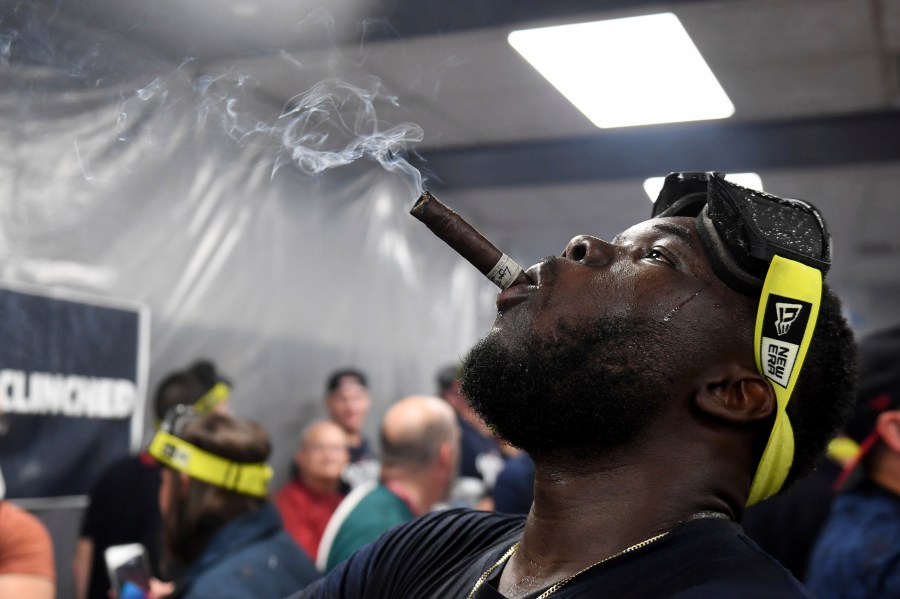 Cleveland Guardians' Jhonkensy Noel celebrates in the clubhouse after they defeated the Minnesota Twins to clinch a baseball playoff berth, Thursday, Sept. 19, 2024, in Cleveland. (AP Photo/Nick Cammett)