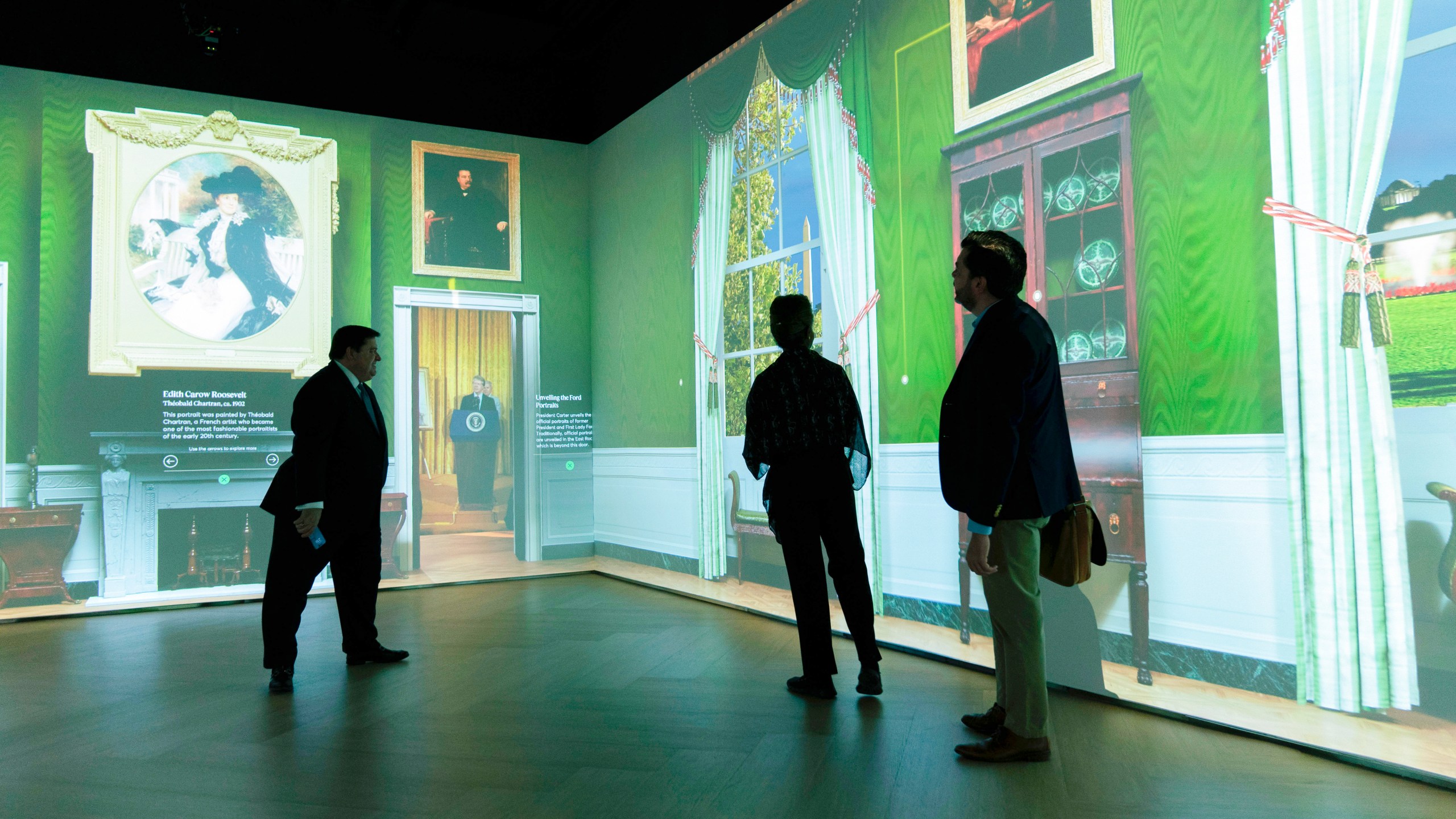 White House Historical Association President Stewart McLaurin tour members of the media in an interactive 3D room of the White House Green Room as is today, shown at The People's House exhibit, Monday, Sept. 16, 2024 in Washington. (AP Photo/Jose Luis Magana)