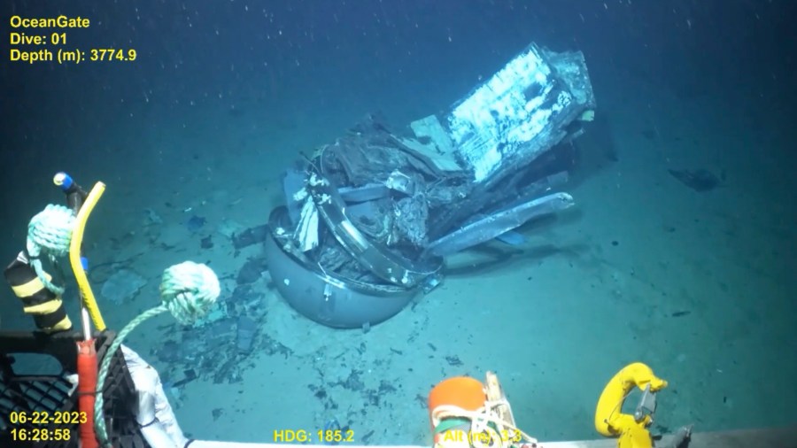 This June 2023 United States Coast Guard still frame from video provided by Pelagic Research Services, shows remains of the Titan submersible, center, on the floor of the Atlantic Ocean. (U.S. Coast Guard Video courtesy Pelagic Research Services via AP)