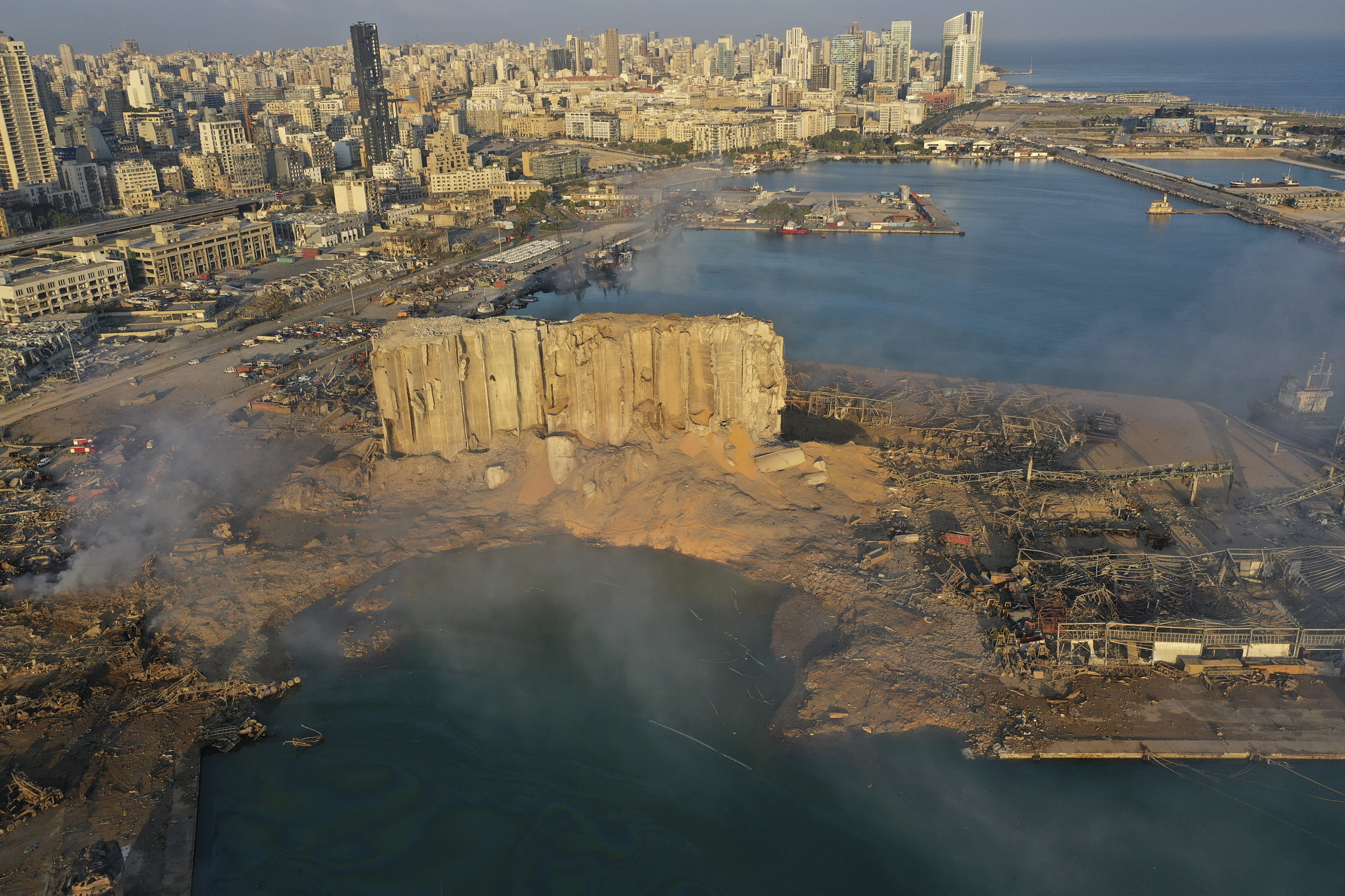 FILE - A drone picture shows the scene of an explosion that hit the seaport of Beirut, Lebanon, on Aug. 5, 2020. (AP Photo/Hussein Malla, File)