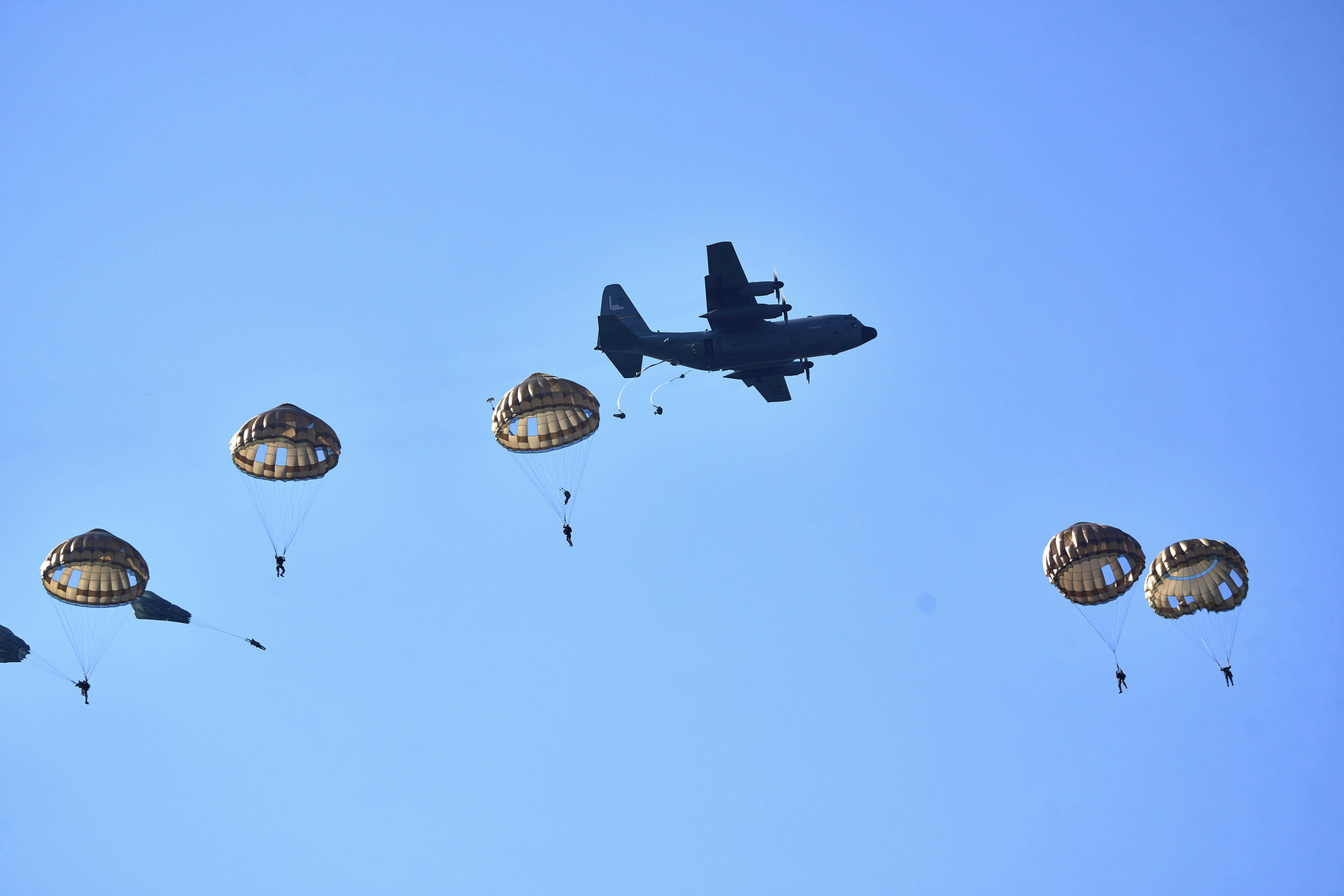 Parachutists jump over Ginkel Heath Netherlands, Saturday, Sept. 21, 2024, to mark the 80th anniversary of an audacious by unsuccessful World War II mission codenamed Market Garden to take key bridges in the Netherlands. (AP Photo/Phil Nijhuis)