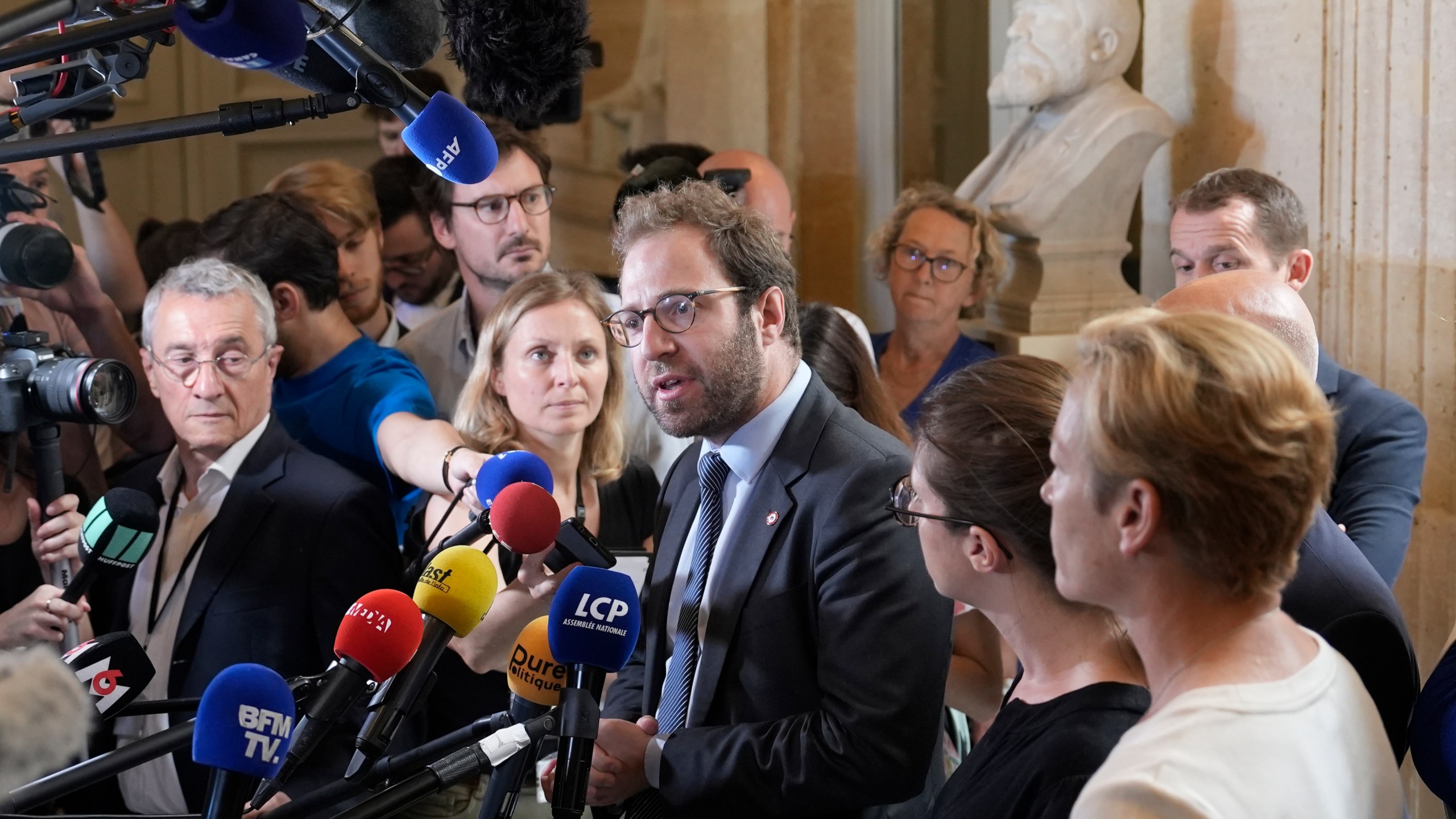 FILE - Antoine Armand, center, deputy for the French Alps Savoie region, speaks at the National Assembly, Thursday, June 8, 2023 in Paris. (AP Photo/Lewis Joly, File)