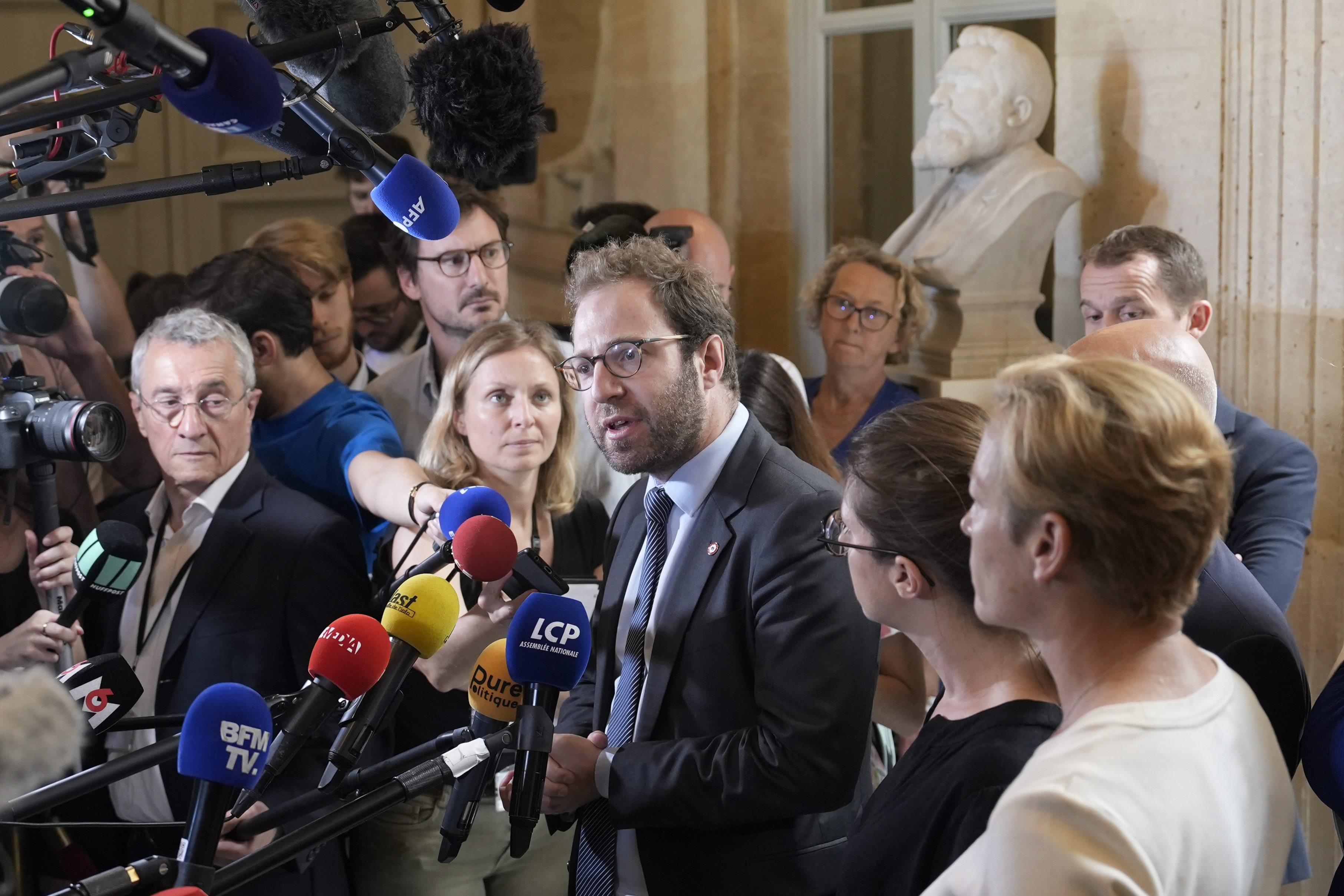 FILE - Antoine Armand, center, deputy for the French Alps Savoie region, speaks at the National Assembly, Thursday, June 8, 2023 in Paris. (AP Photo/Lewis Joly, File)