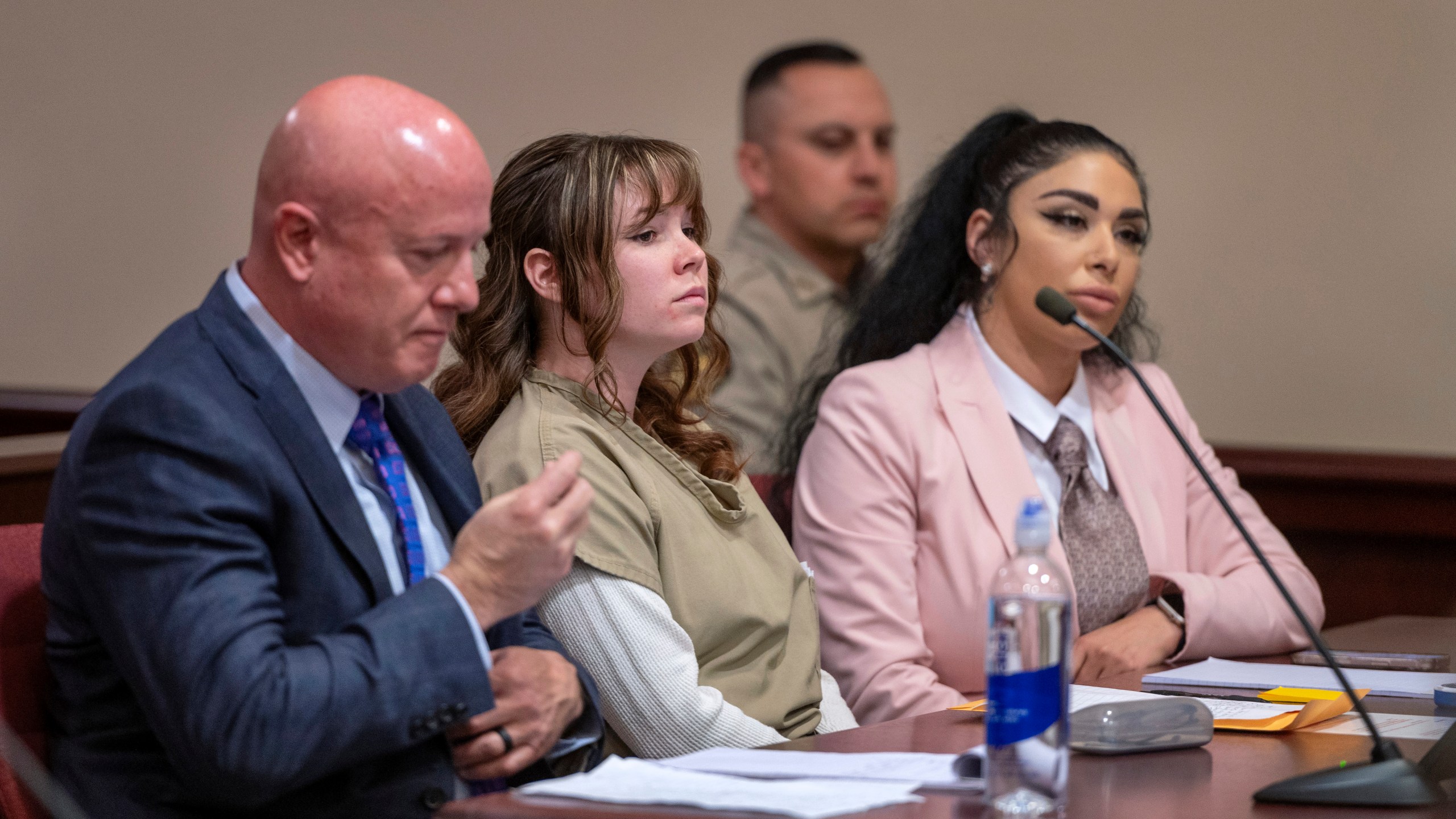 FILE - Hannah Gutierrez-Reed, center, with her attorney Jason Bowles, left, and paralegal Carmella Sisneros, right, prepare for a sentencing hearing in state district court in Santa Fe, N.M., April 15, 2024. (Eddie Moore/The Albuquerque Journal via AP, Pool, File)