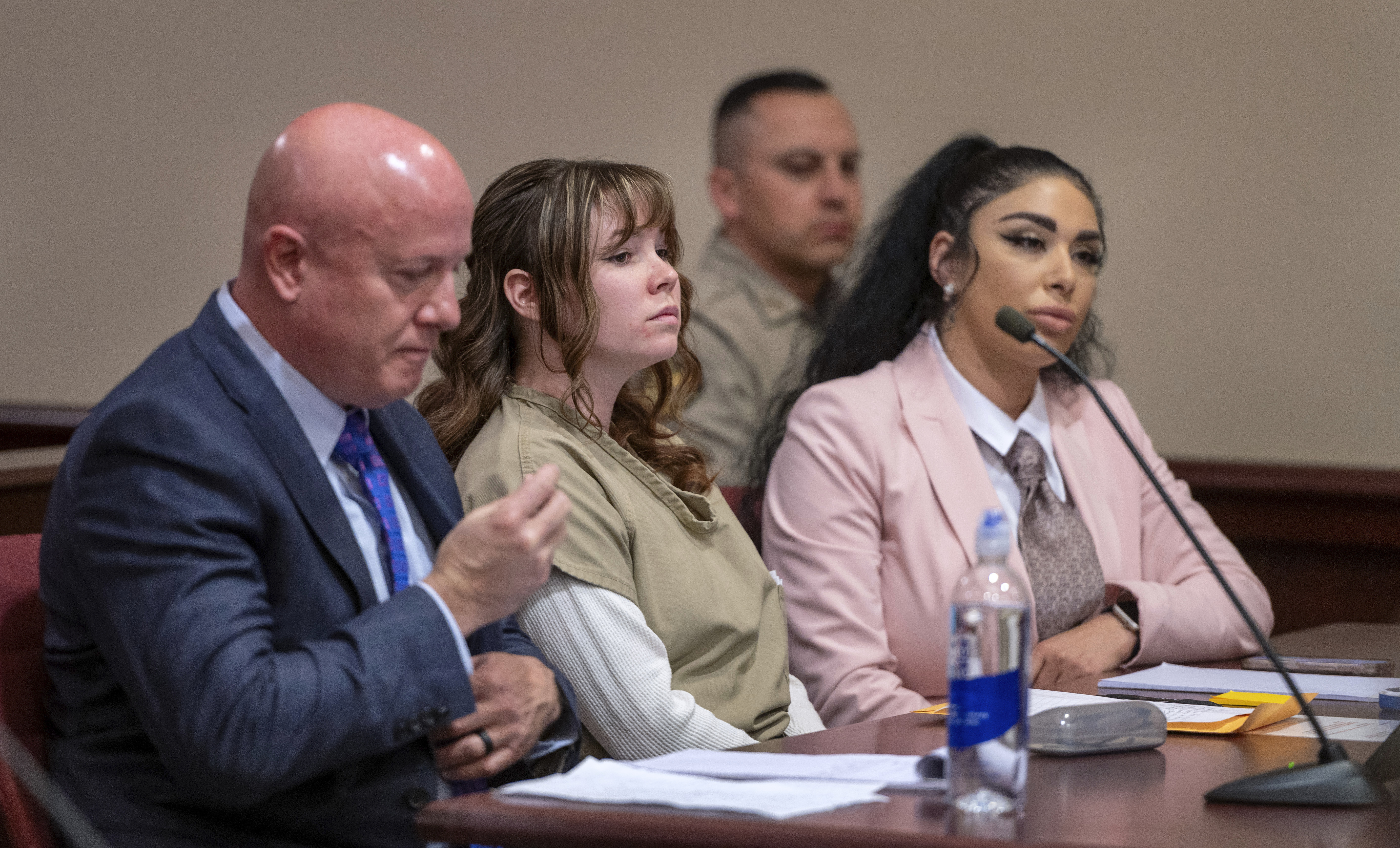 FILE - Hannah Gutierrez-Reed, center, with her attorney Jason Bowles, left, and paralegal Carmella Sisneros, right, prepare for a sentencing hearing in state district court in Santa Fe, N.M., April 15, 2024. (Eddie Moore/The Albuquerque Journal via AP, Pool, File)