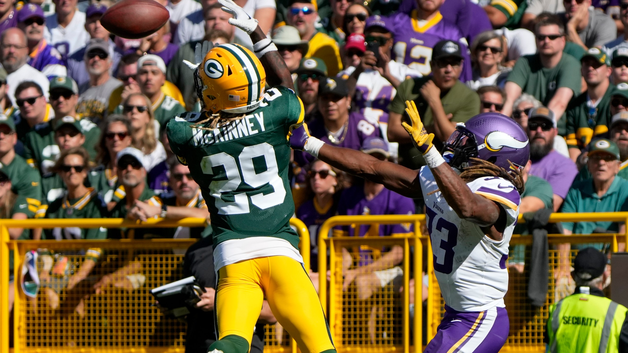 Green Bay Packers safety Xavier McKinney (29) intercepts a pass intended for Minnesota Vikings running back Aaron Jones, right, during the second half of an NFL football game Sunday, Sept. 29, 2024, in Green Bay, Wis. (AP Photo/Morry Gash)