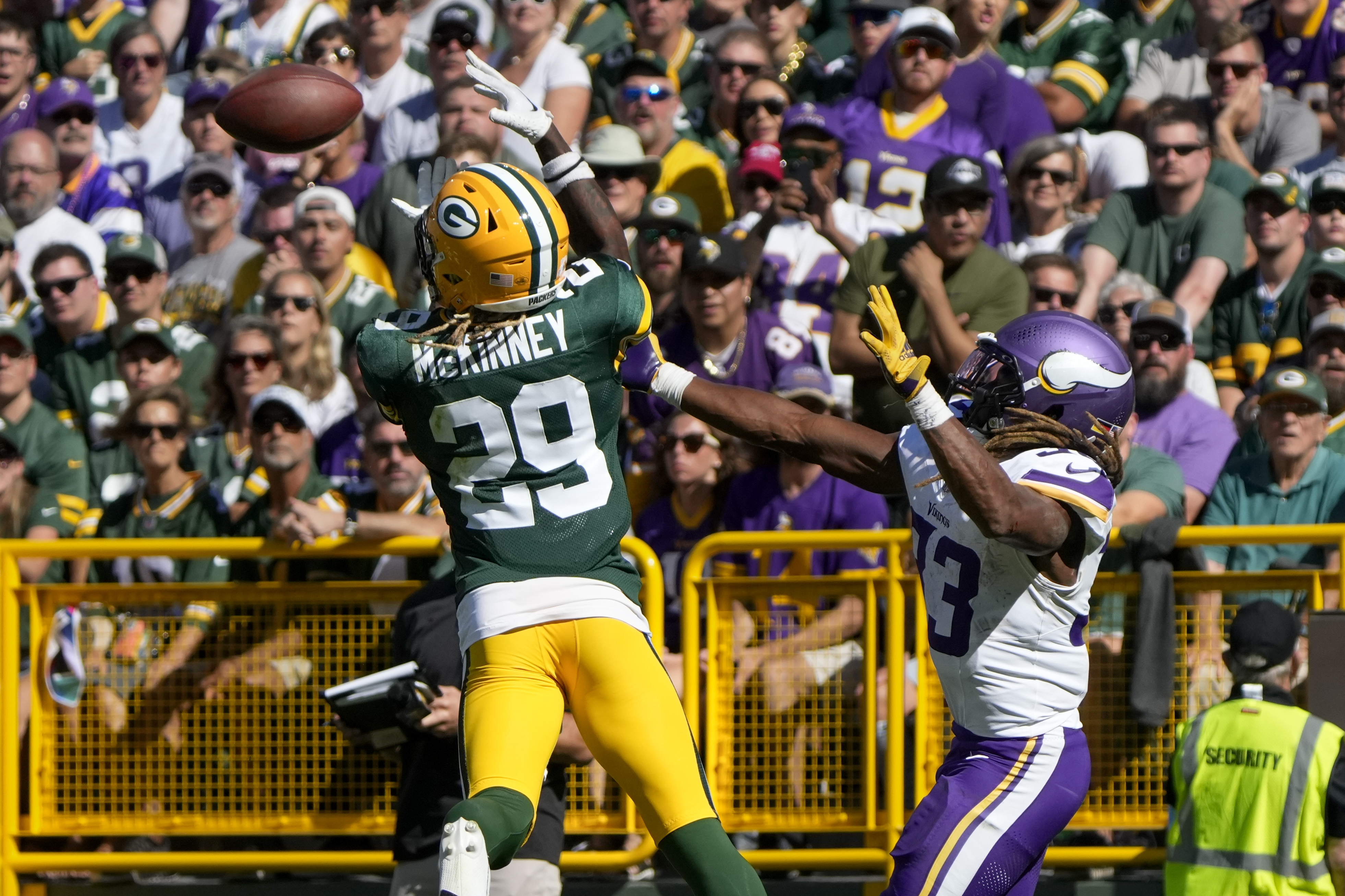 Green Bay Packers safety Xavier McKinney (29) intercepts a pass intended for Minnesota Vikings running back Aaron Jones, right, during the second half of an NFL football game Sunday, Sept. 29, 2024, in Green Bay, Wis. (AP Photo/Morry Gash)