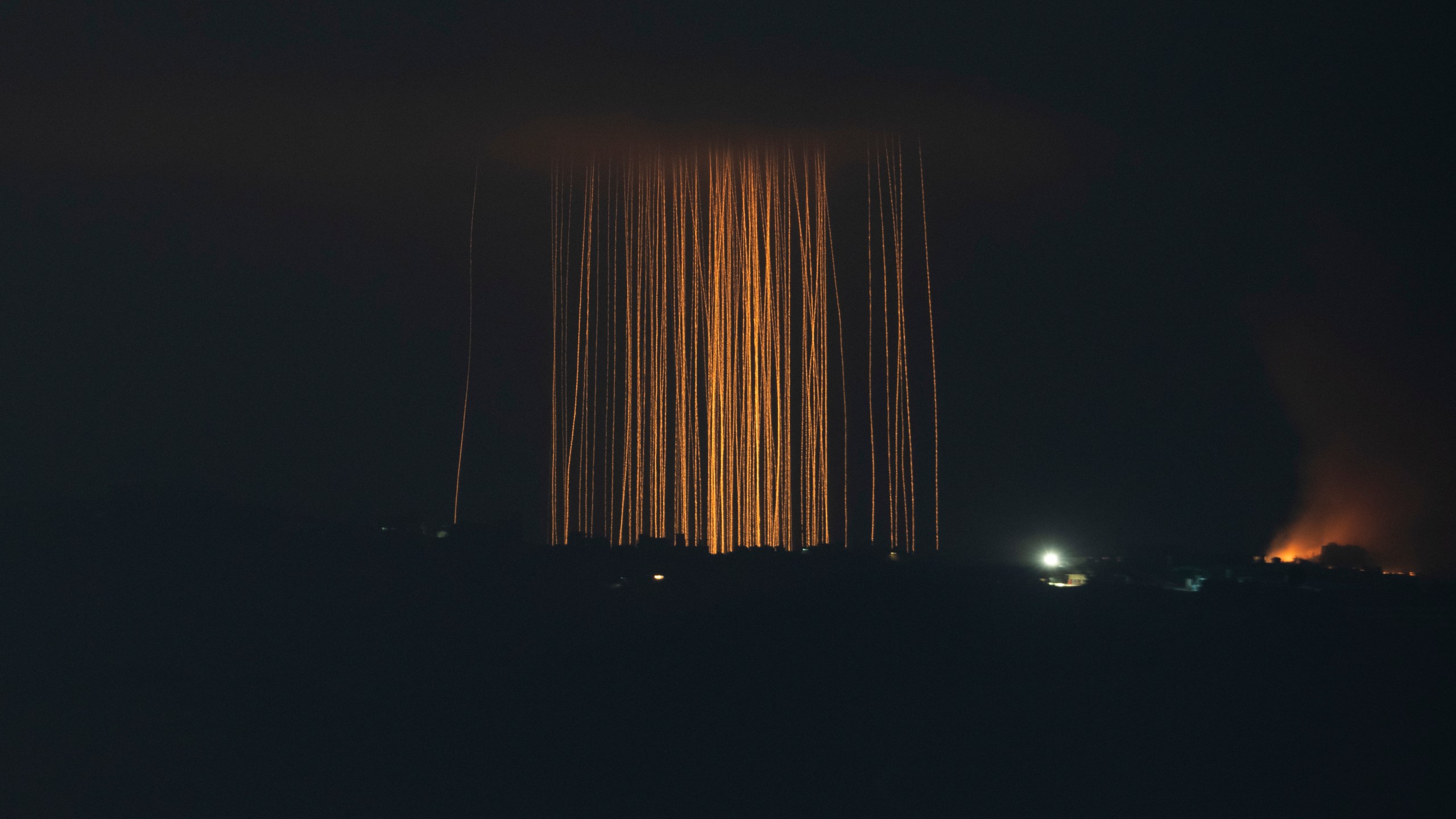 Israeli shelling hit an area in southern Lebanon as seen from northern Israel, Monday, Sept. 30, 2024. (AP Photo/Leo Correa)